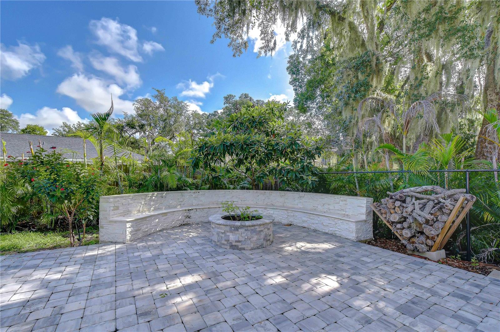 Stacked-stone fire pit with built-in seating.