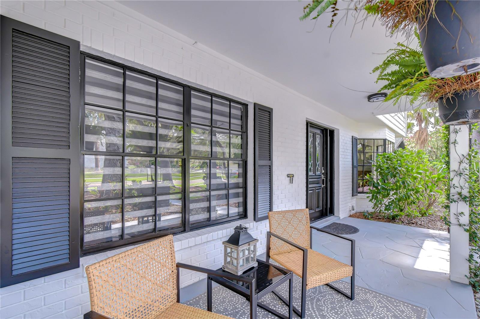 Expansive front porch creating a warm and inviting entrance.