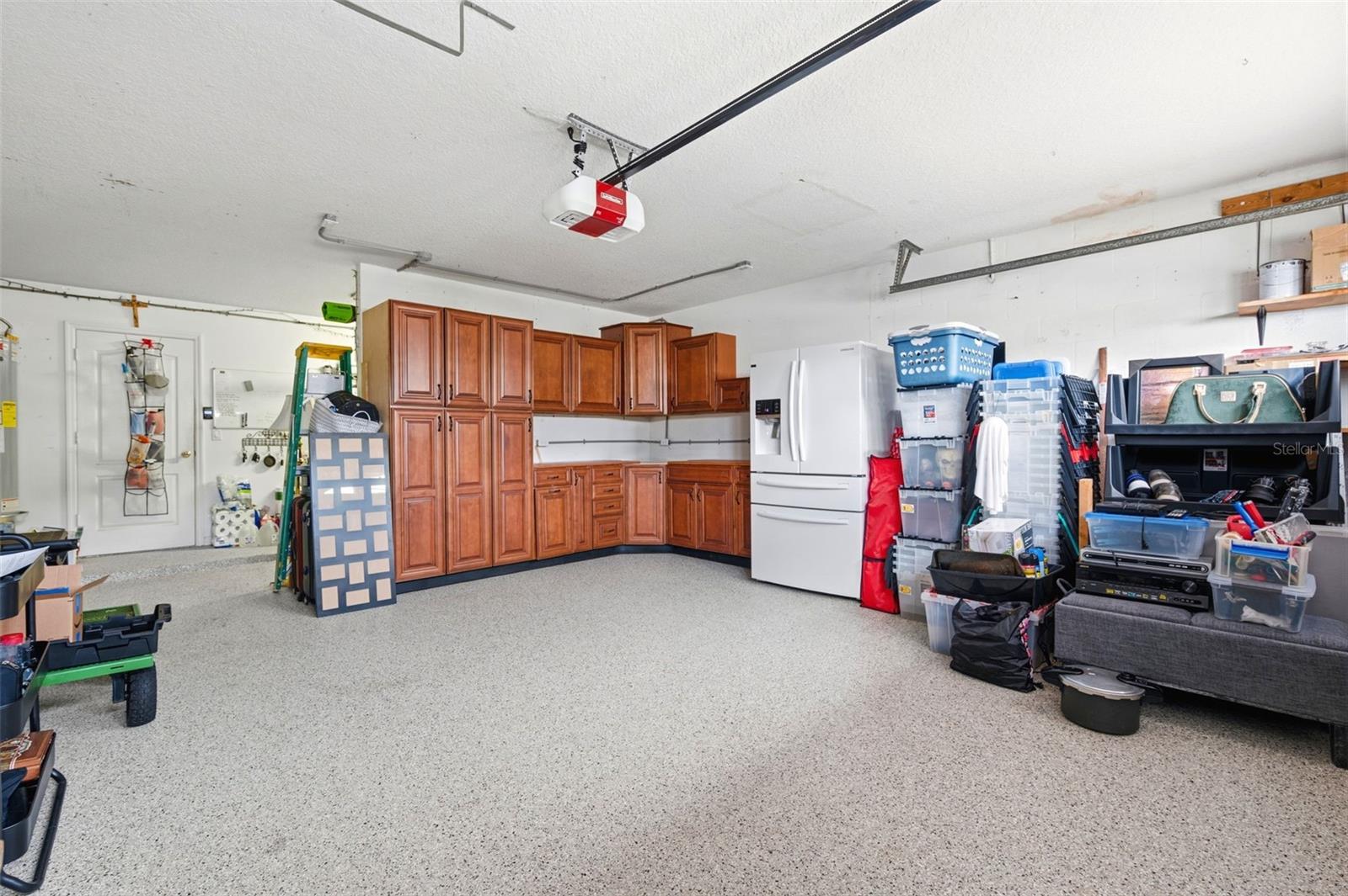 NEW EPOXY FLOORINGEXTRA SPACE BEHIND STORAGE CABINETS