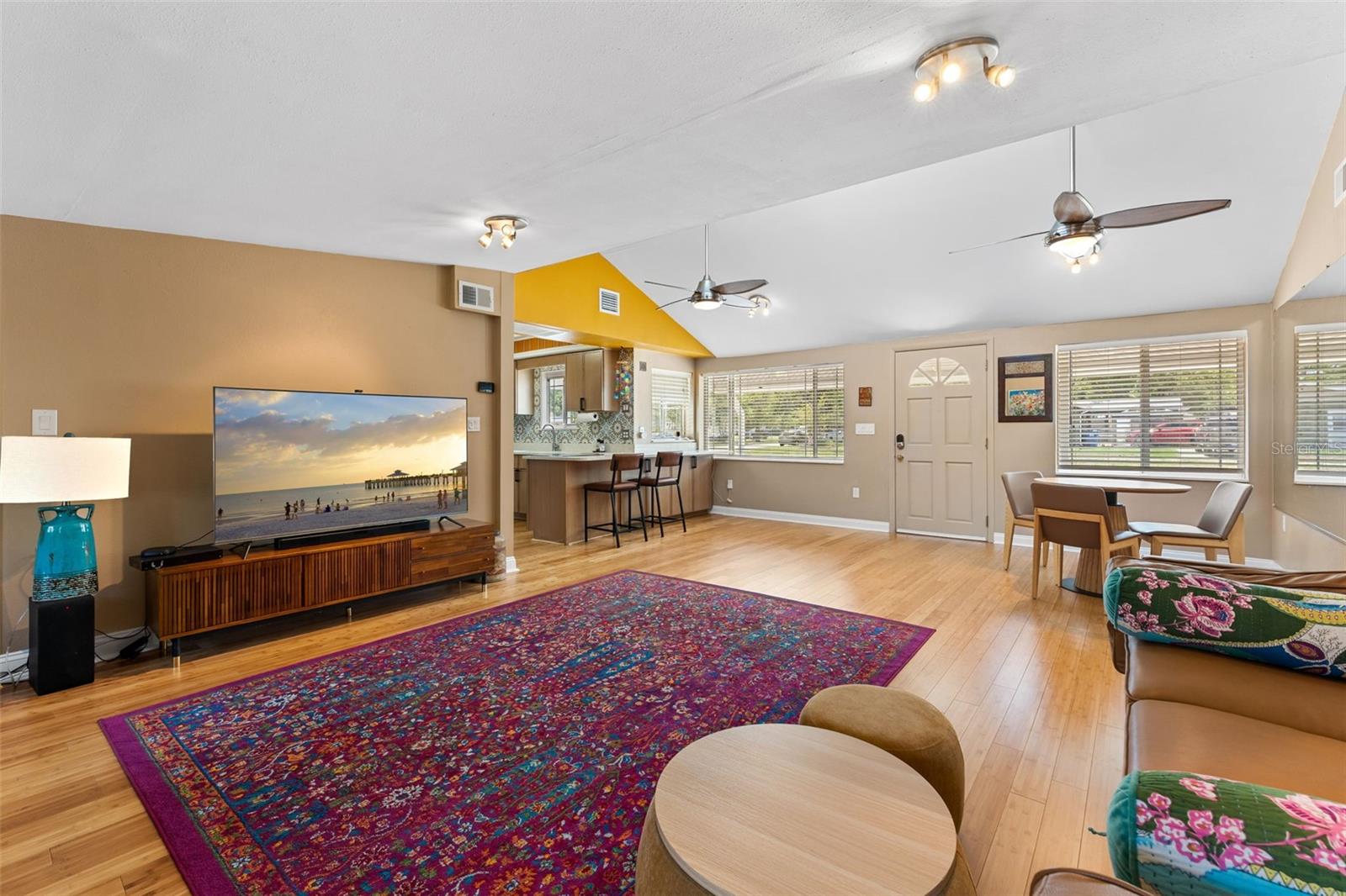 Living Room towards entry, dining and bar to kitchen