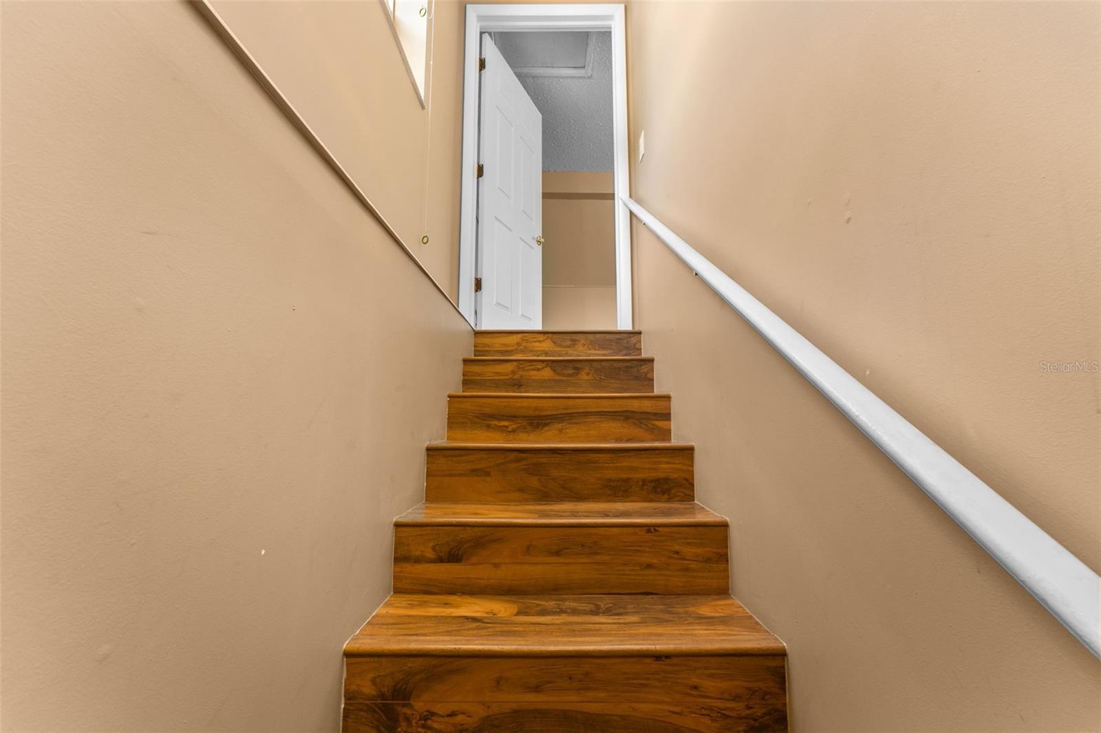 Stairs to primary bedroom