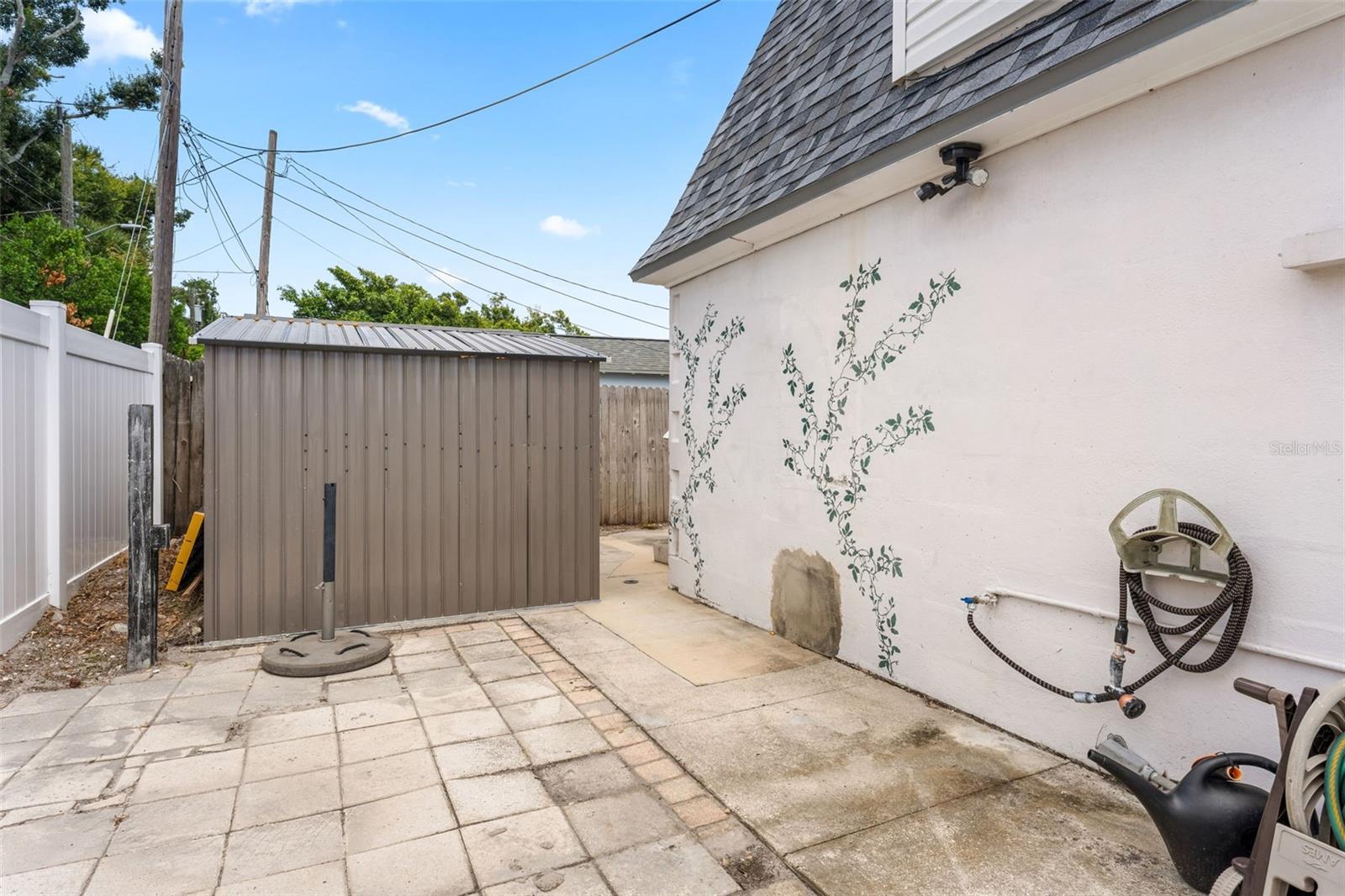 Rear of house; private stairway to primary suite