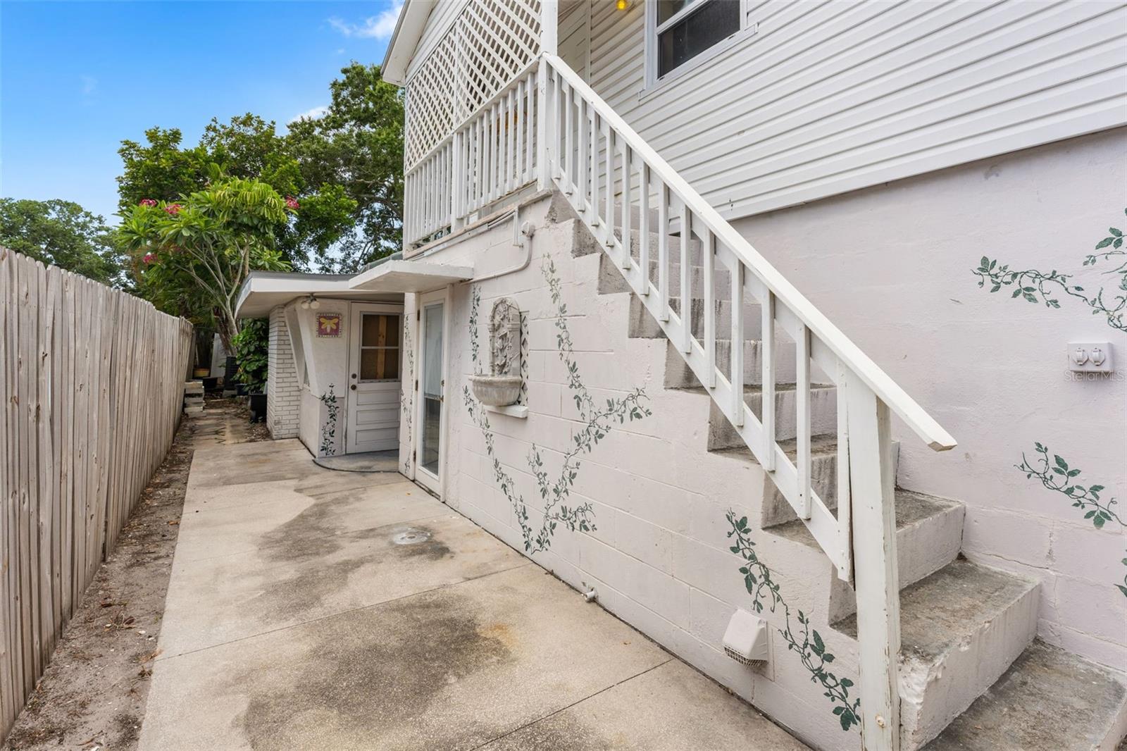 Rear of house; private stairway to primary suite