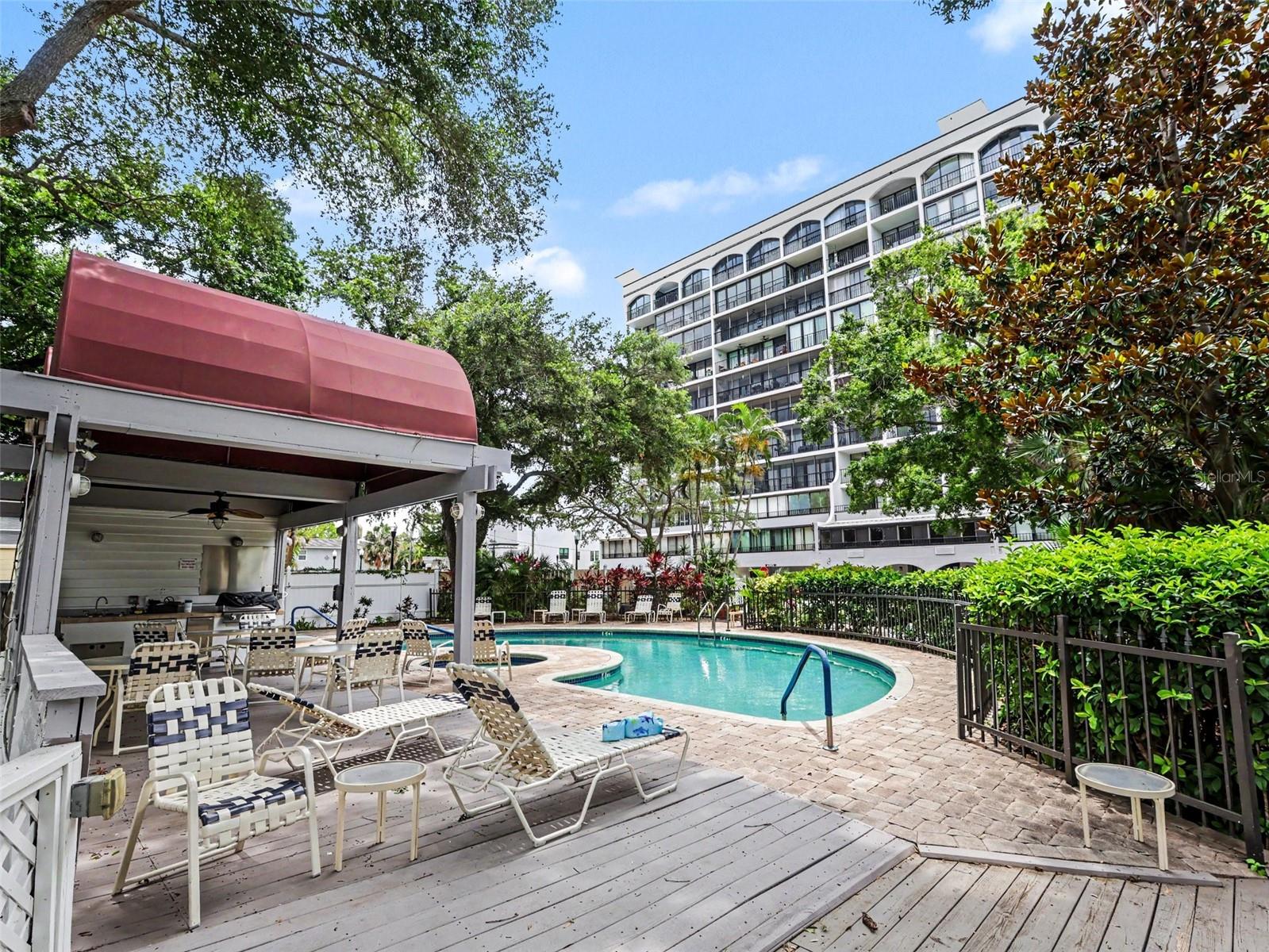 Pool with seating, grill, bathrooms.
