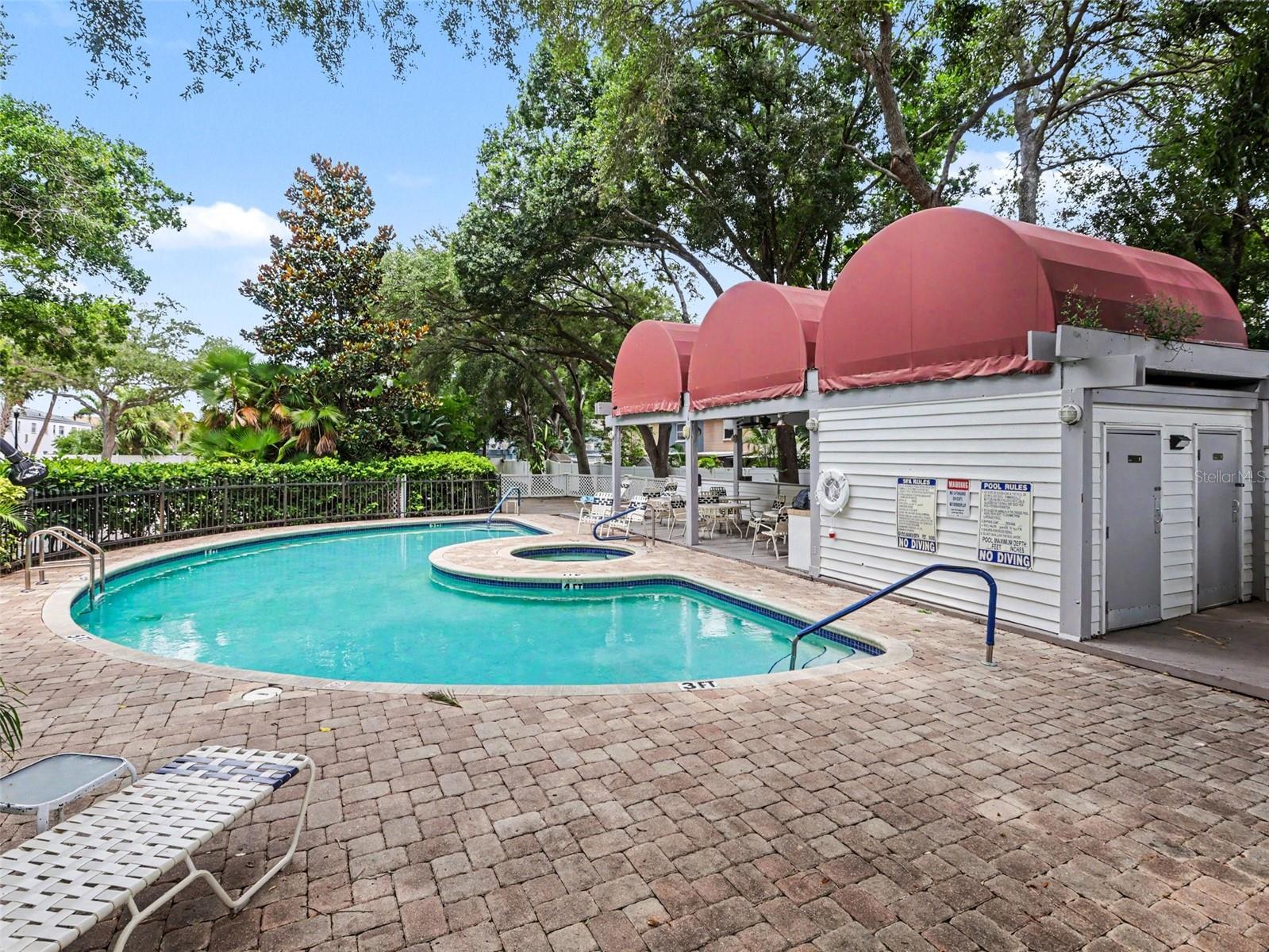 Pool with seating, grill, bathrooms.