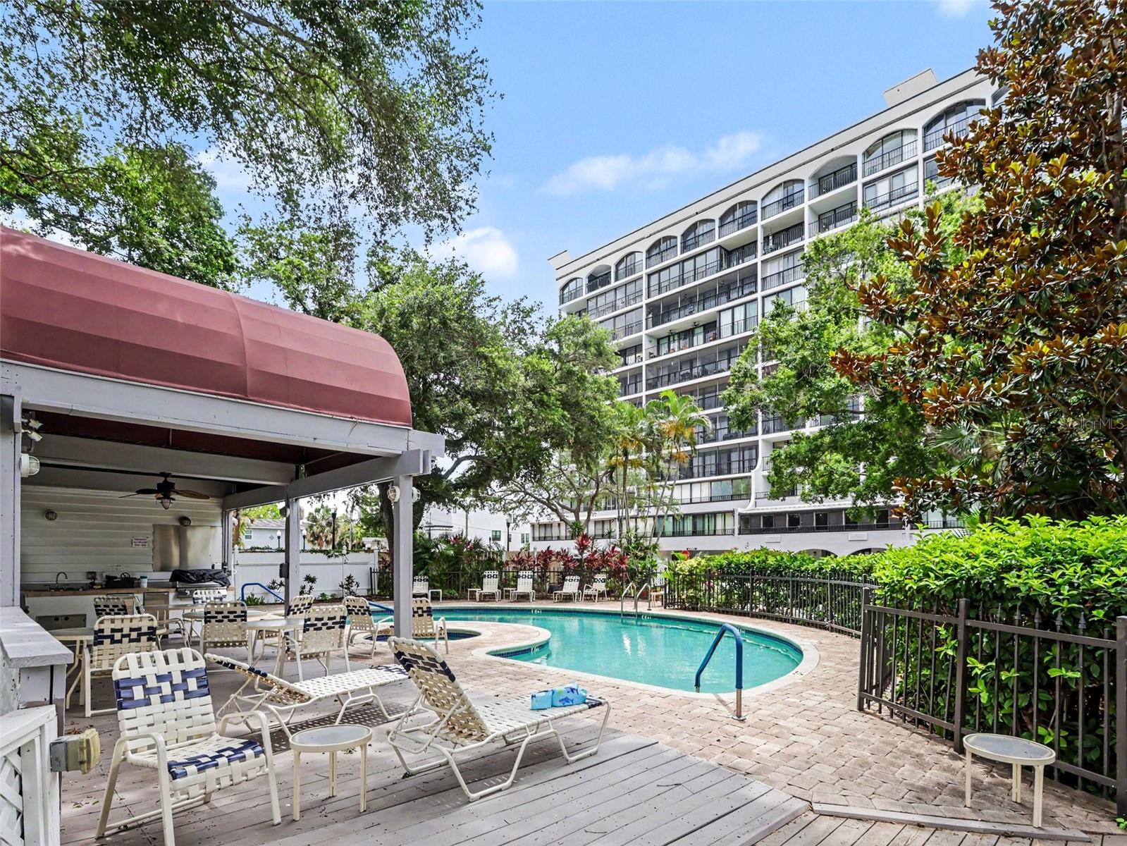 Pool with seating, grill, bathrooms.