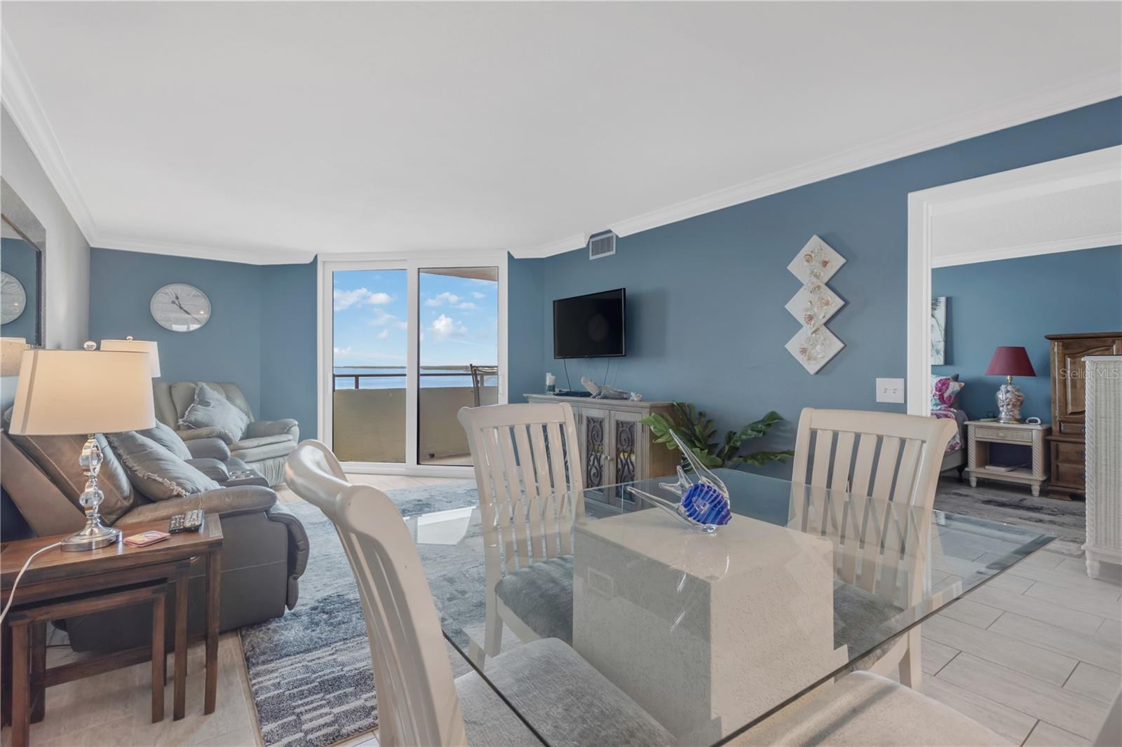Living Room / Dining Area and entrance to Master Bedroom on right.