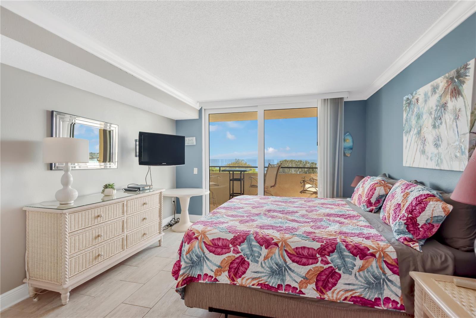Expansive Master Bedroom with sliders to open, covered balcony.  Your view every day!!