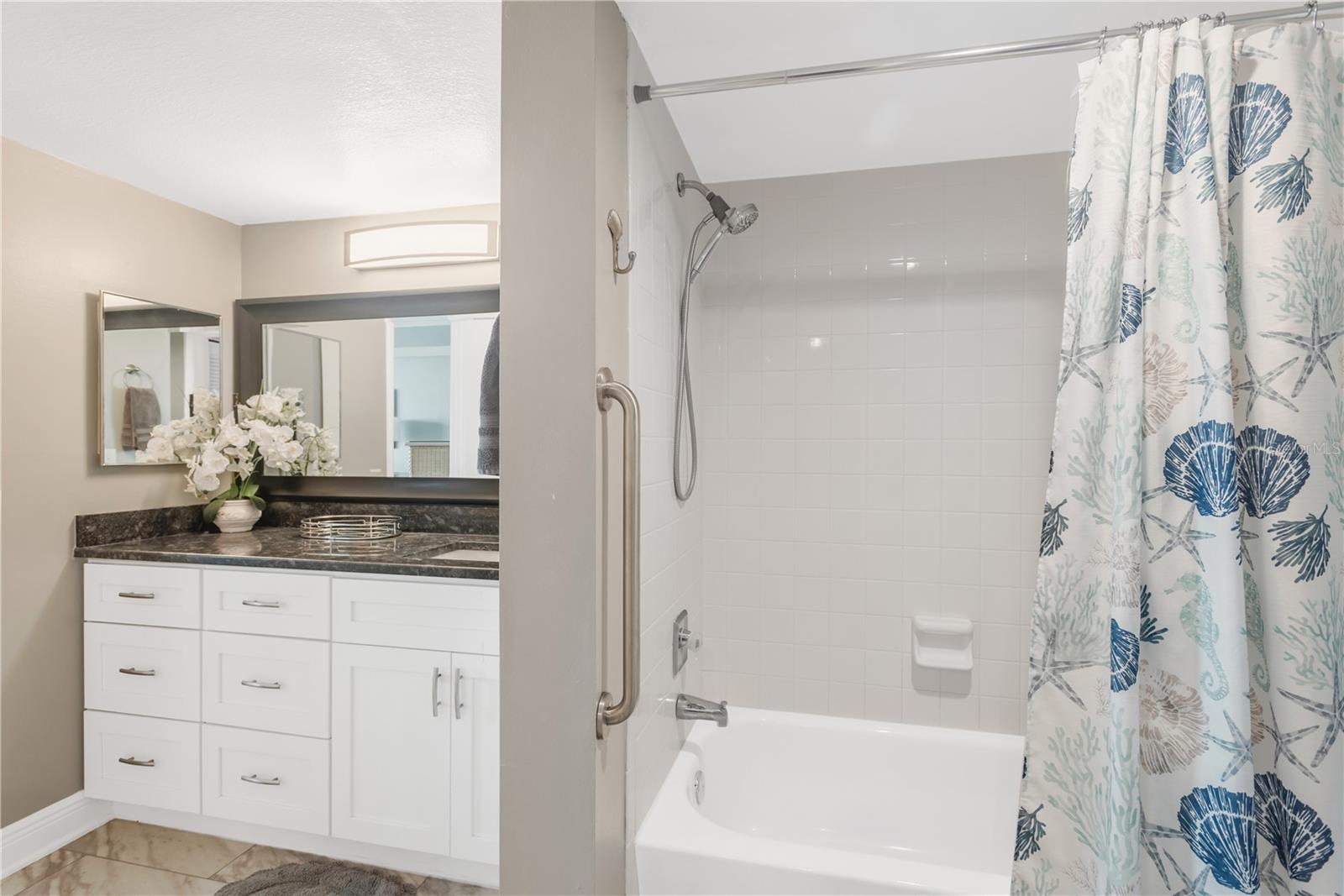 Master Bath with tub / shower combination, full tile.