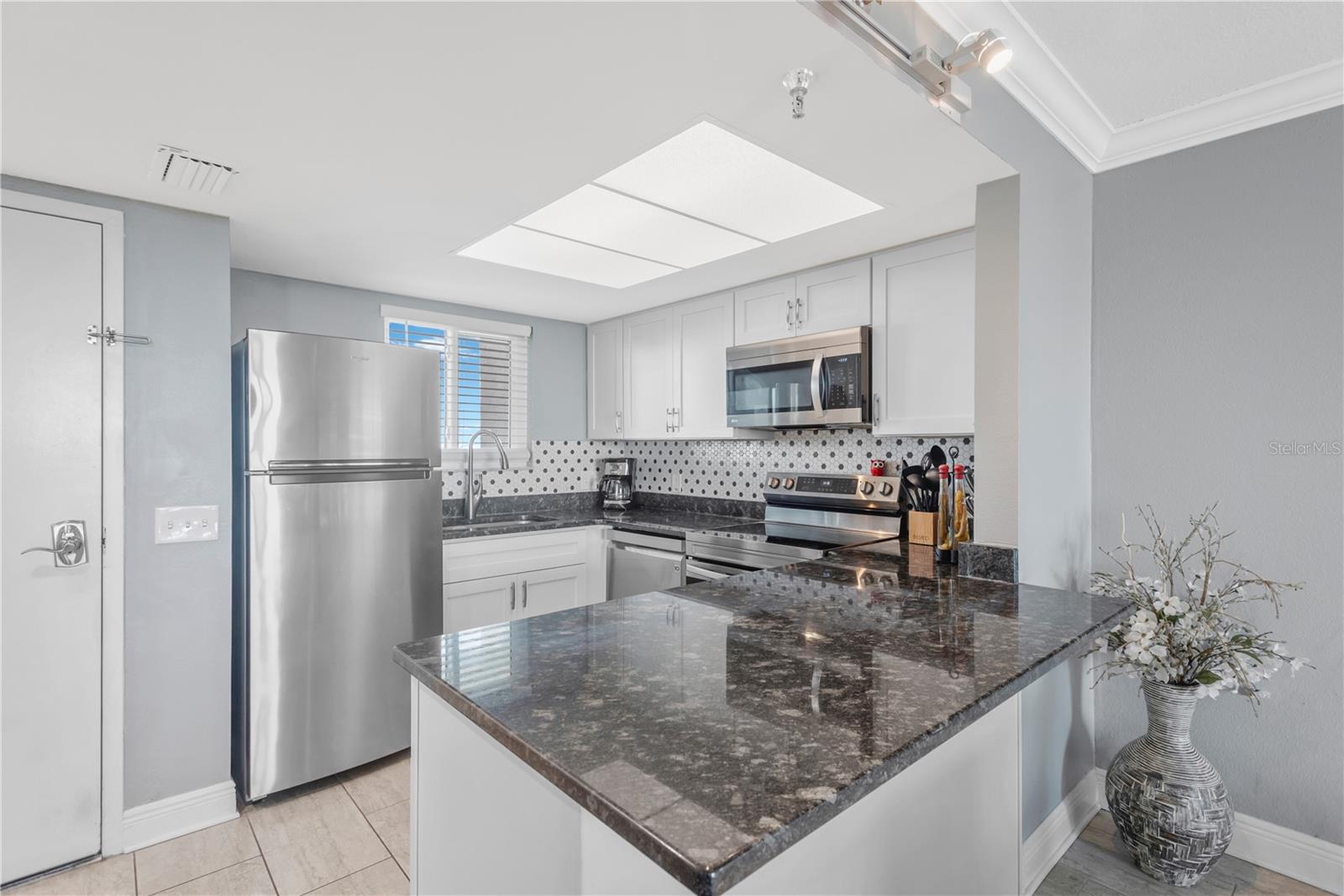 Step inside and experience this exquisite kitchen with stainless appliances, breakast island and beautiful appointments.