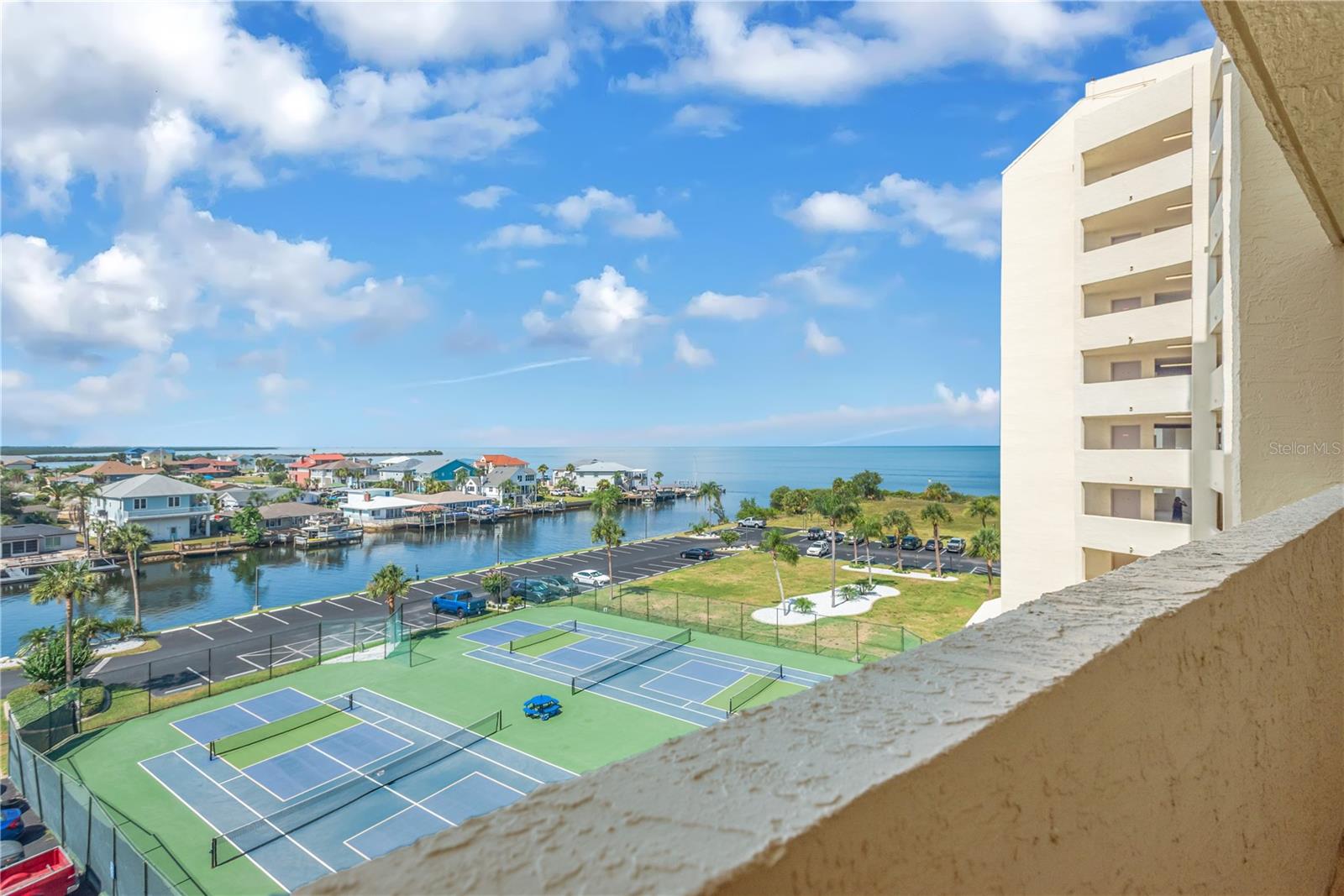 From you front walkway you can see the many tennis/pickle ball courts that can be enjoyed.