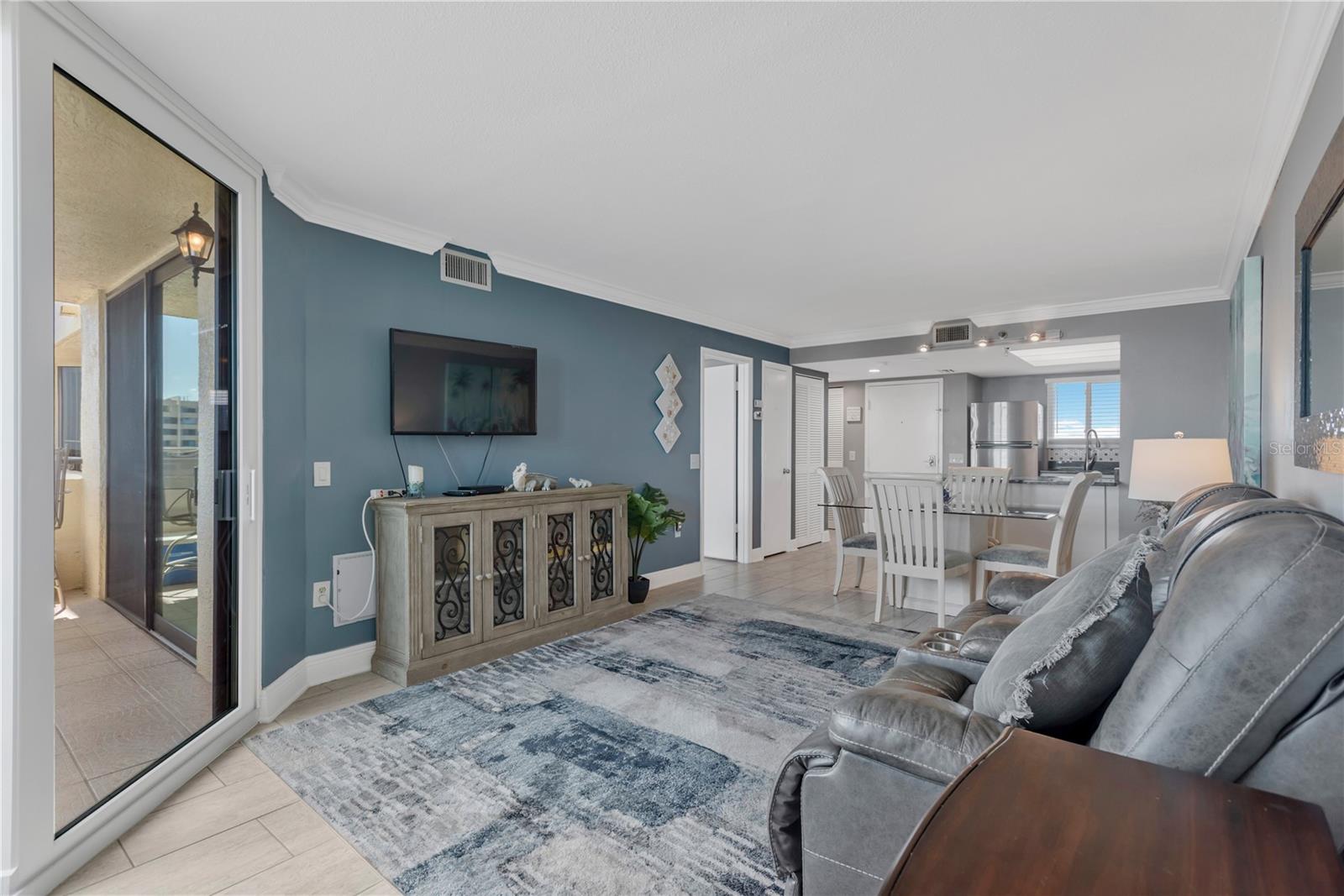 Spacious living area with view of sparkling Gulf waters from you wall of sliders.