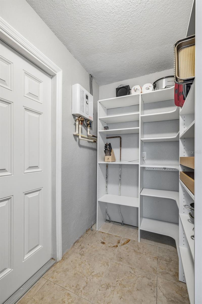Utility room / Pantry / Storage / Laundry room -  Home features a Tankless Water Heater as well as a whole home water softener.