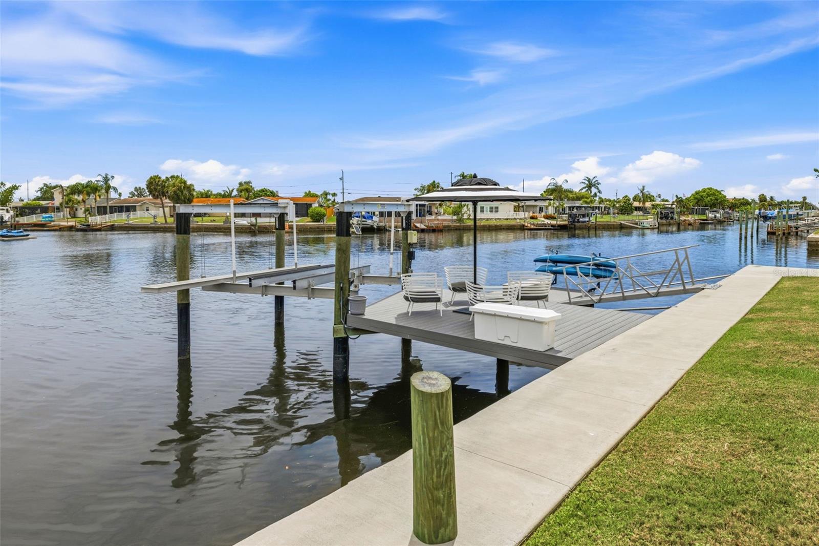 2023 - New Docks! Deck walk-out to the 10,000 lb boat lift including water and electric!  Also a new Floating Dock w/Kayak Storage!