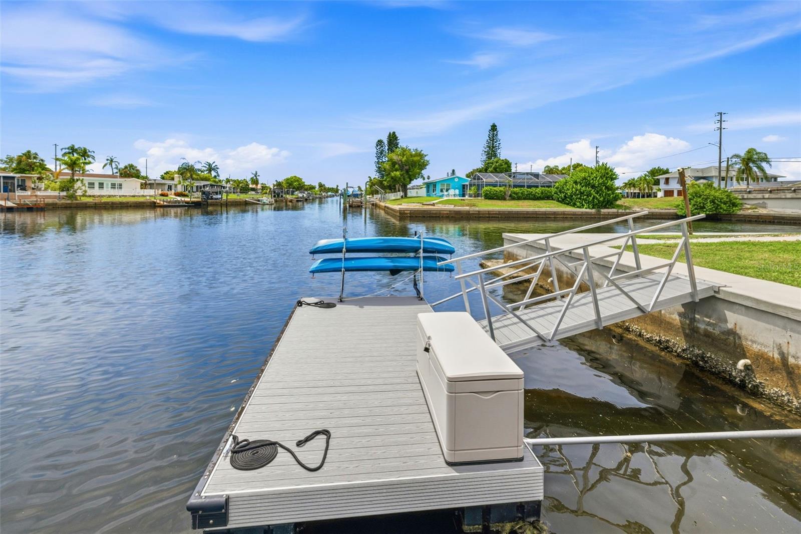 Floating dock w/kayak storage and convenient storage bin