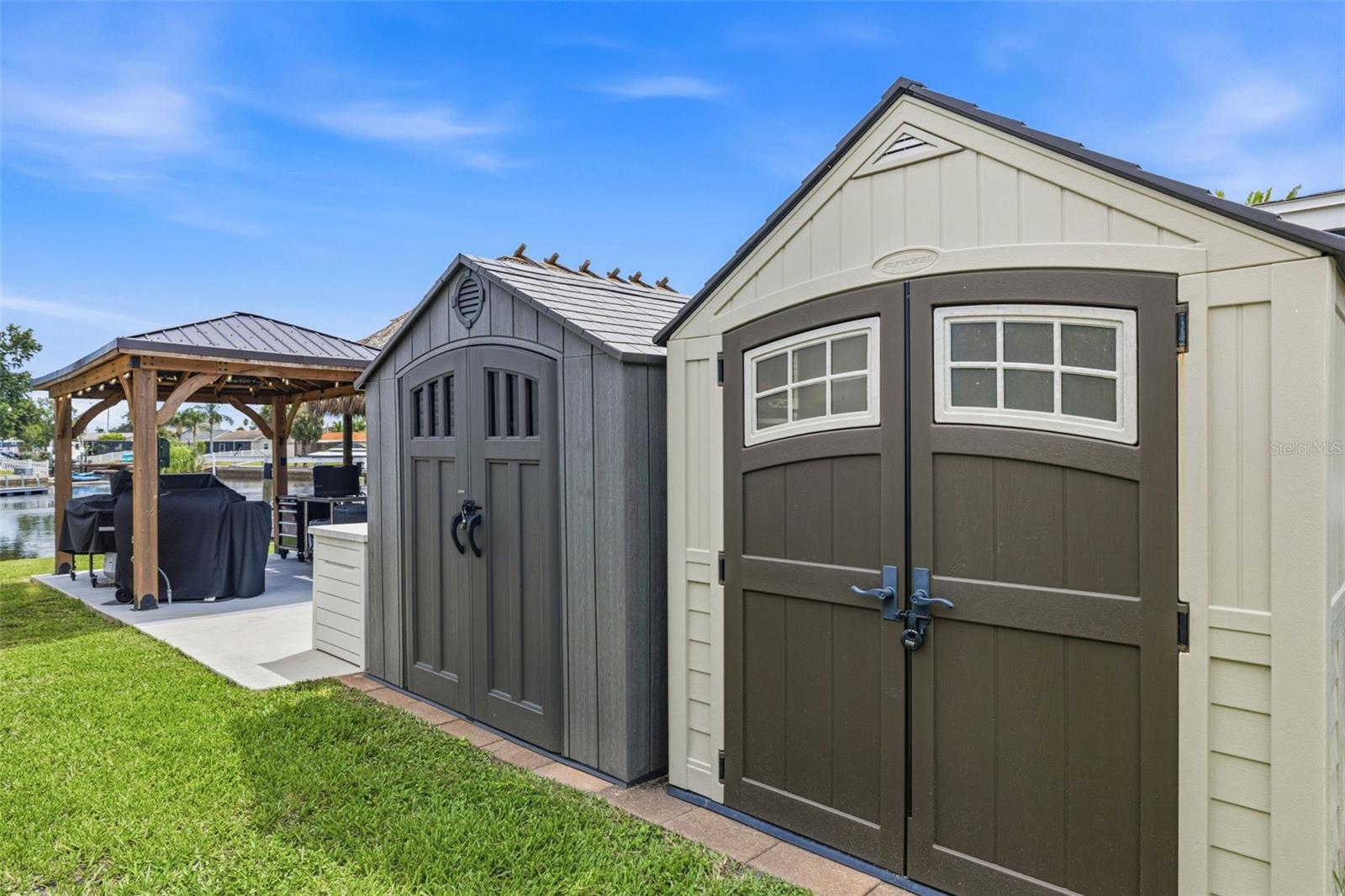 The home includes multiple storage areas, including these two storage and additional storage bins located around the property.