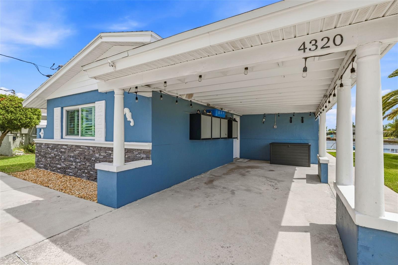 Keyless entry doors and storage under the carport.