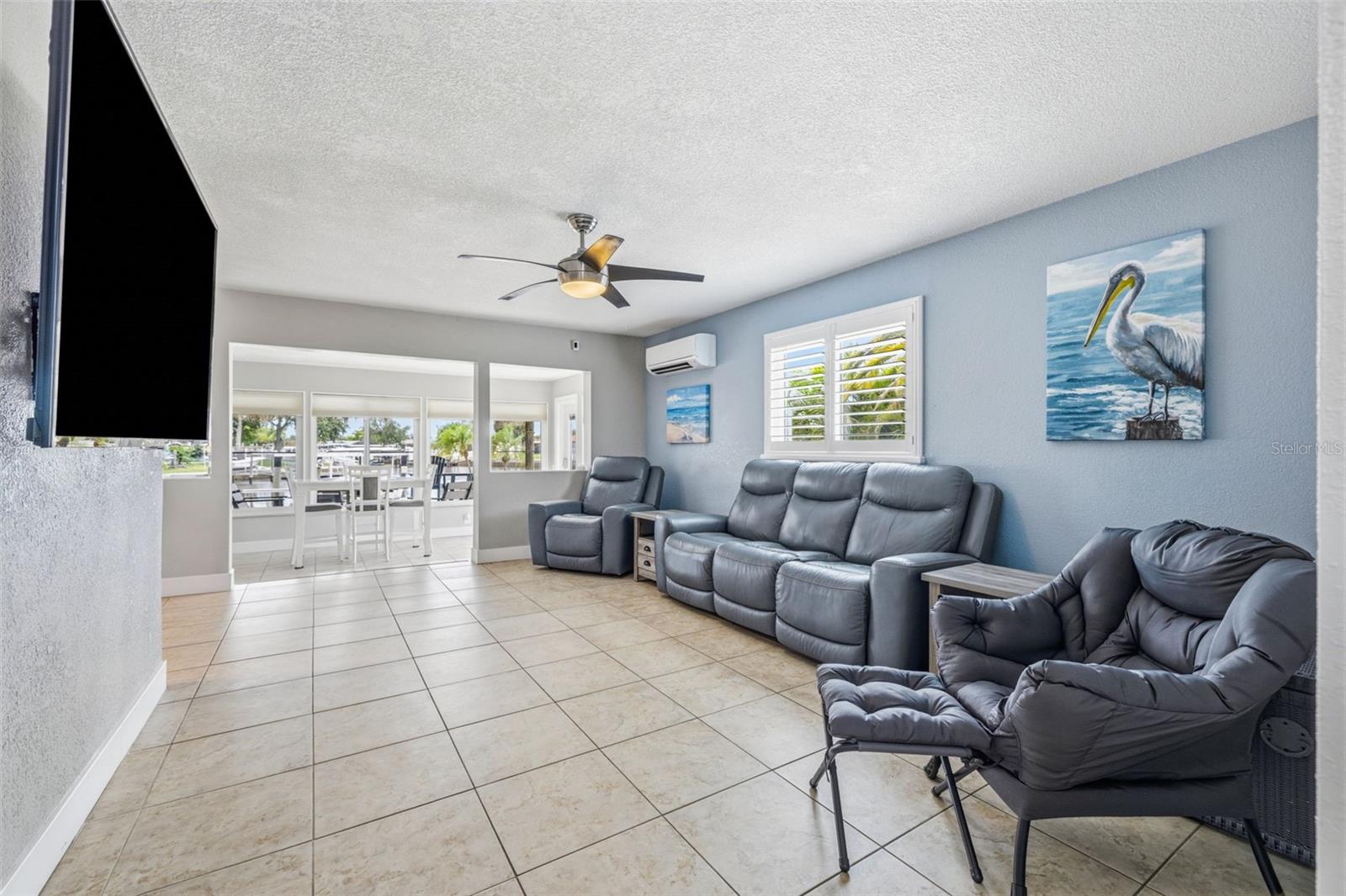 Cool coastal colors throughout the home! Large format 18" tiles in the living room, kitchen and dining room.