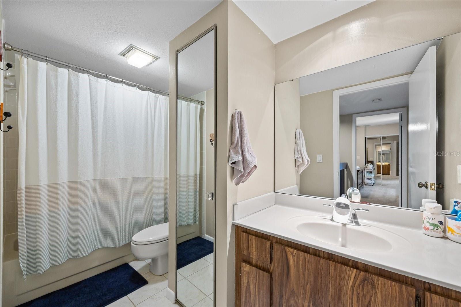 The full guest bedroom upstairs is ample and offers a linen closet.