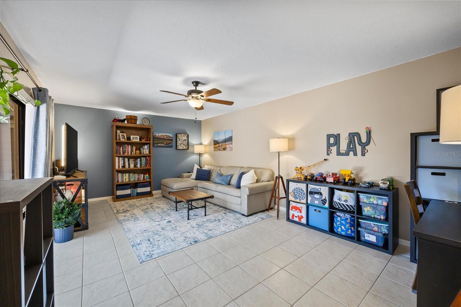 The living area is sizable, currently used as a living, play, and office space, and can be easily transitioned to a variation of personalized interests.