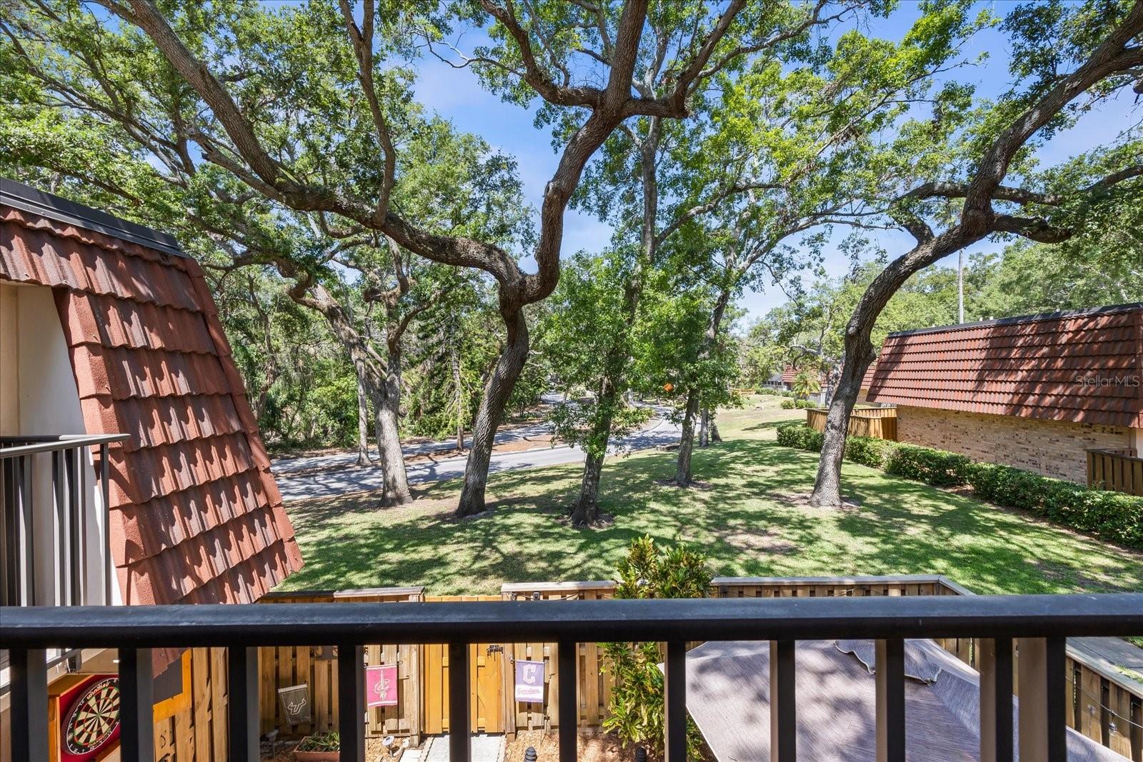 An unobstructed view is offered from the privacy of the primary suite balcony, perfect for morning fresh air or serene sunsets.