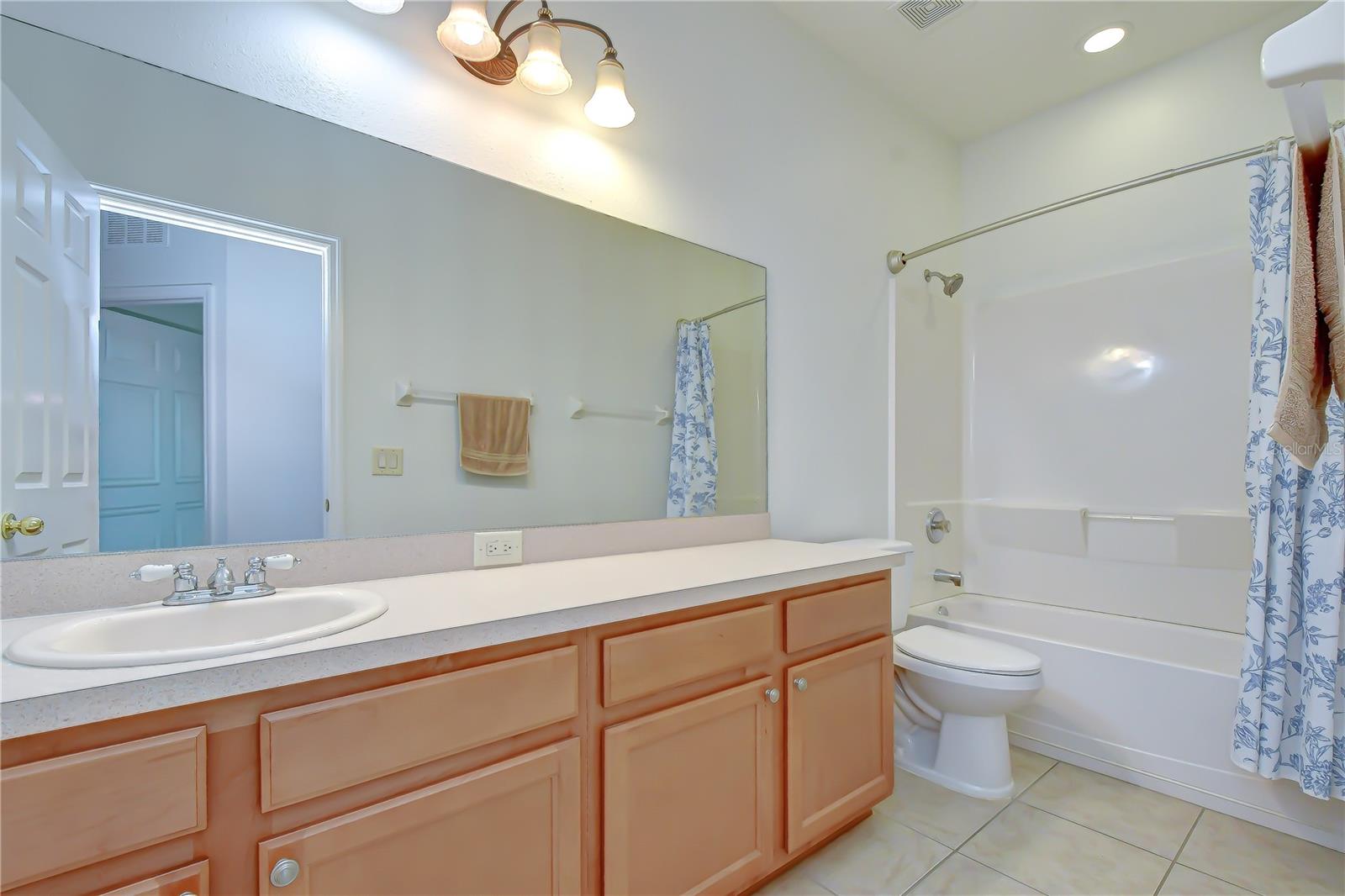 Full secondary bathroom serving additional bedrooms.