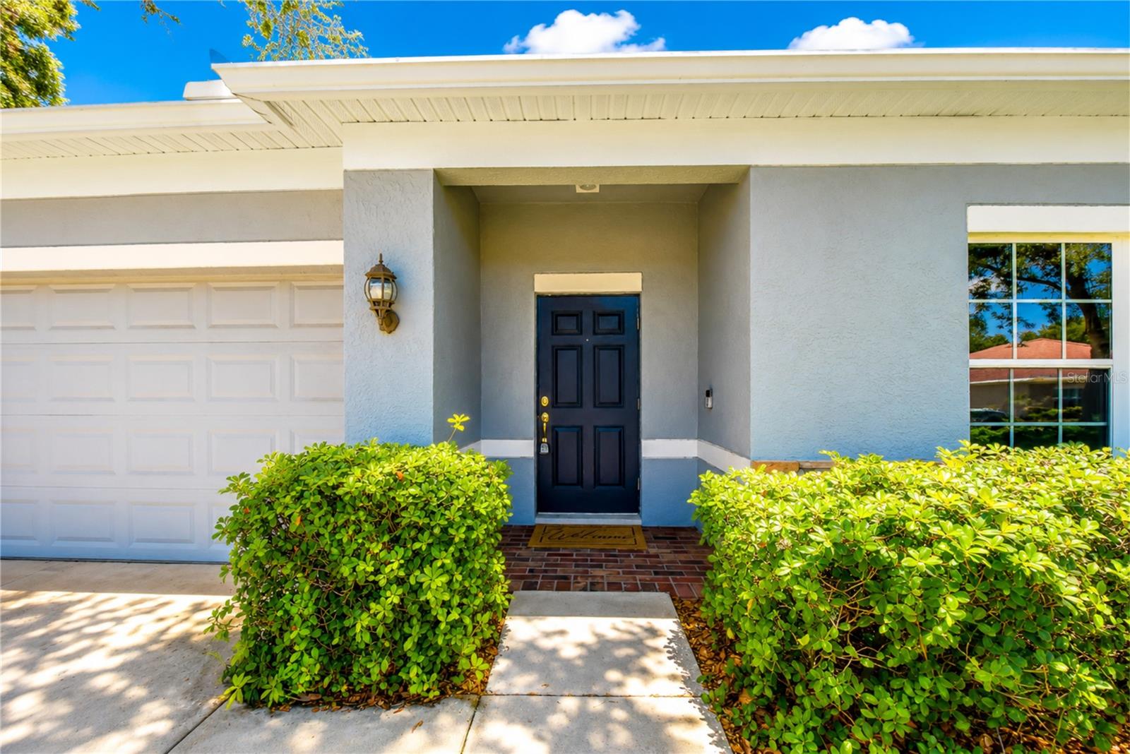 Inviting covered entry leading into the home.