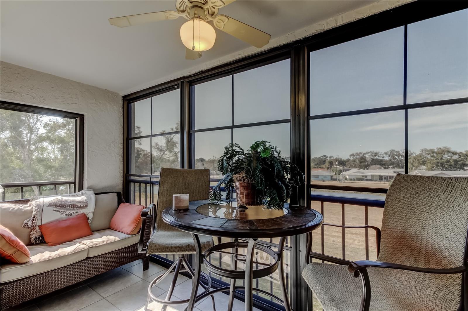 Oversize screened and vinyl window lanai