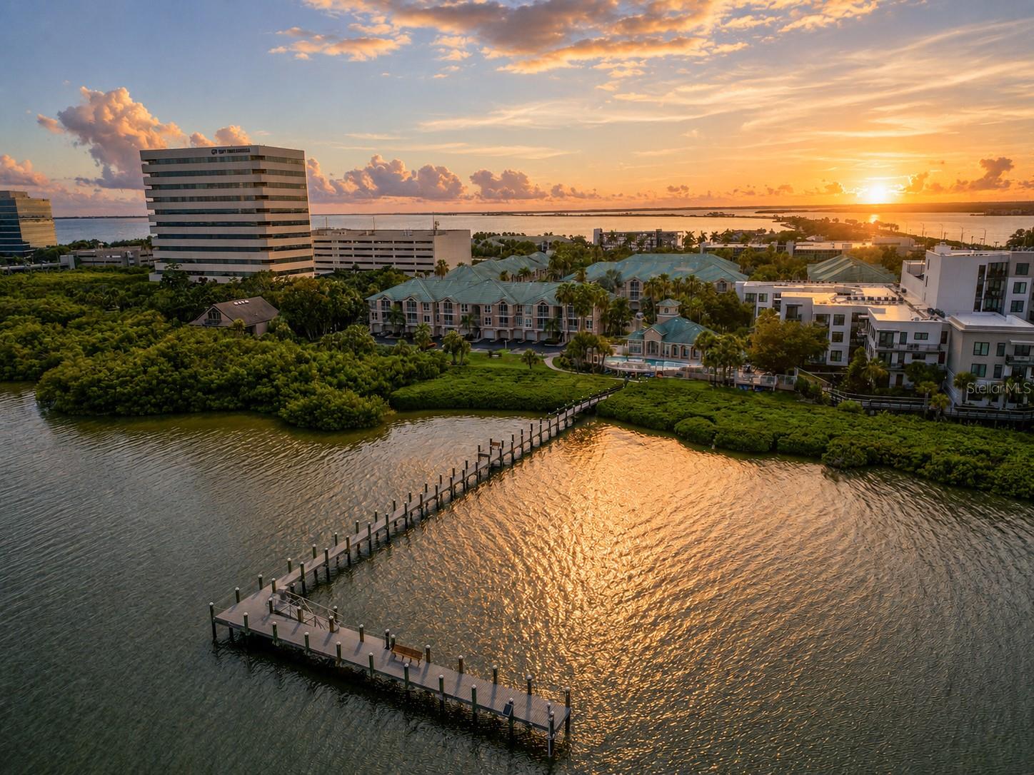 Community dock with access to Tampa Bay, pool, hot tub, and outdoor grill
