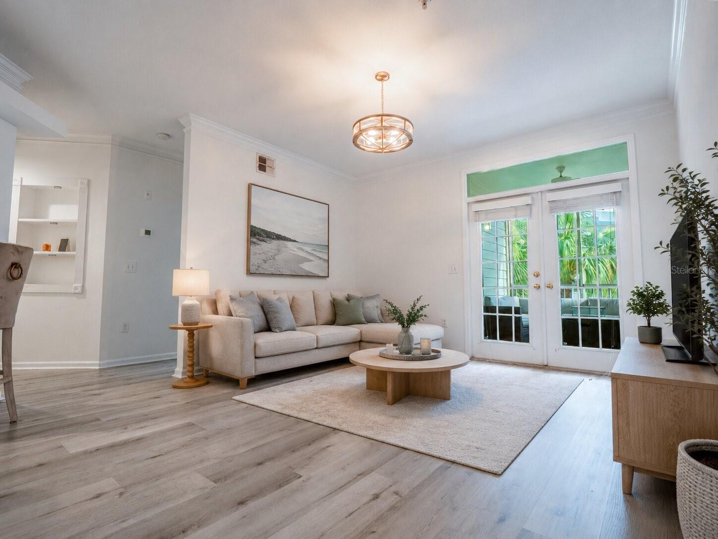 Living room with view of screened in porch