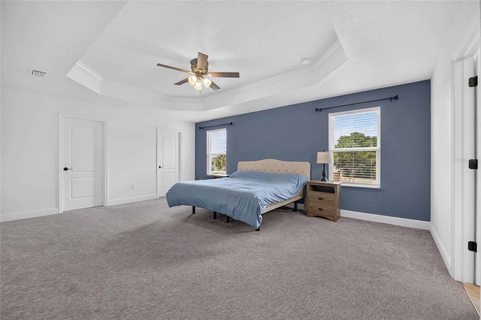 Master suite w/ his & hers walk-in closets