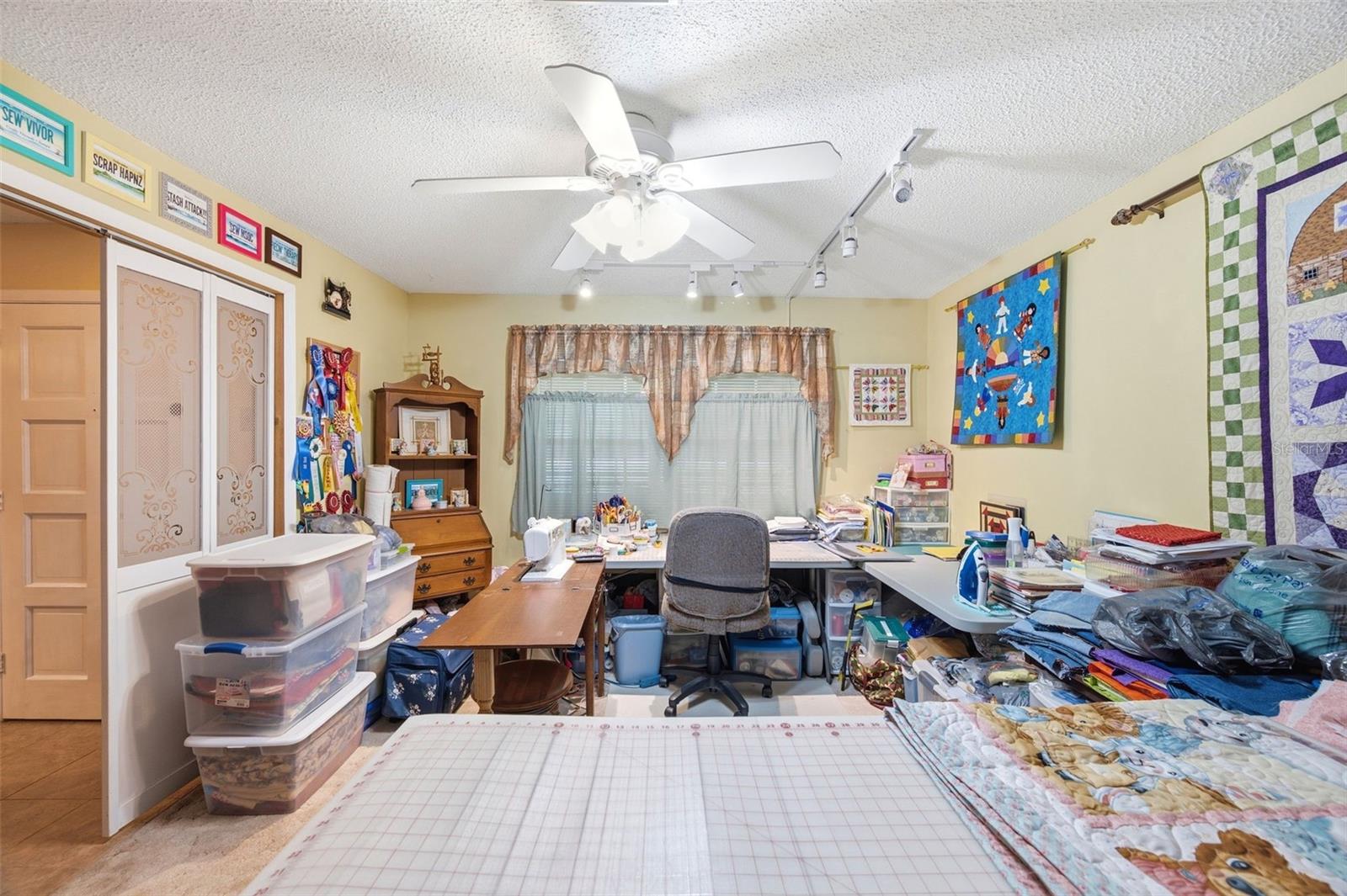 Office/Den used as quilting room.