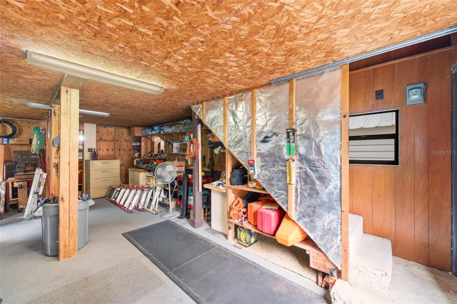 Stairs lead to upstairs apartment.