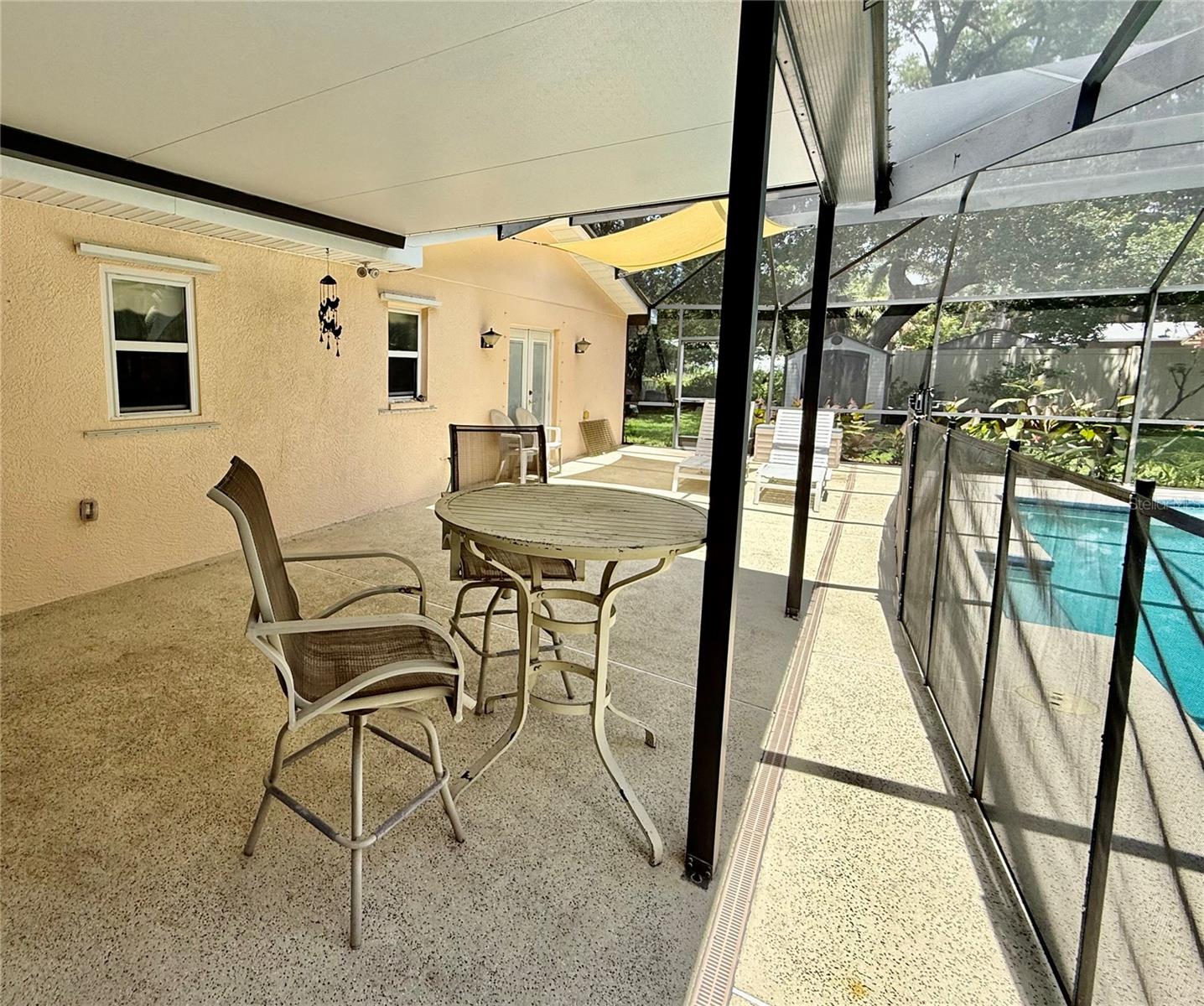 Enjoy a drink and looking out over the large rear yard.