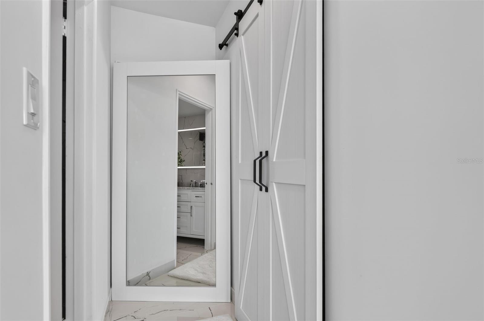 Barn Door entry to Primary Walk in Closet