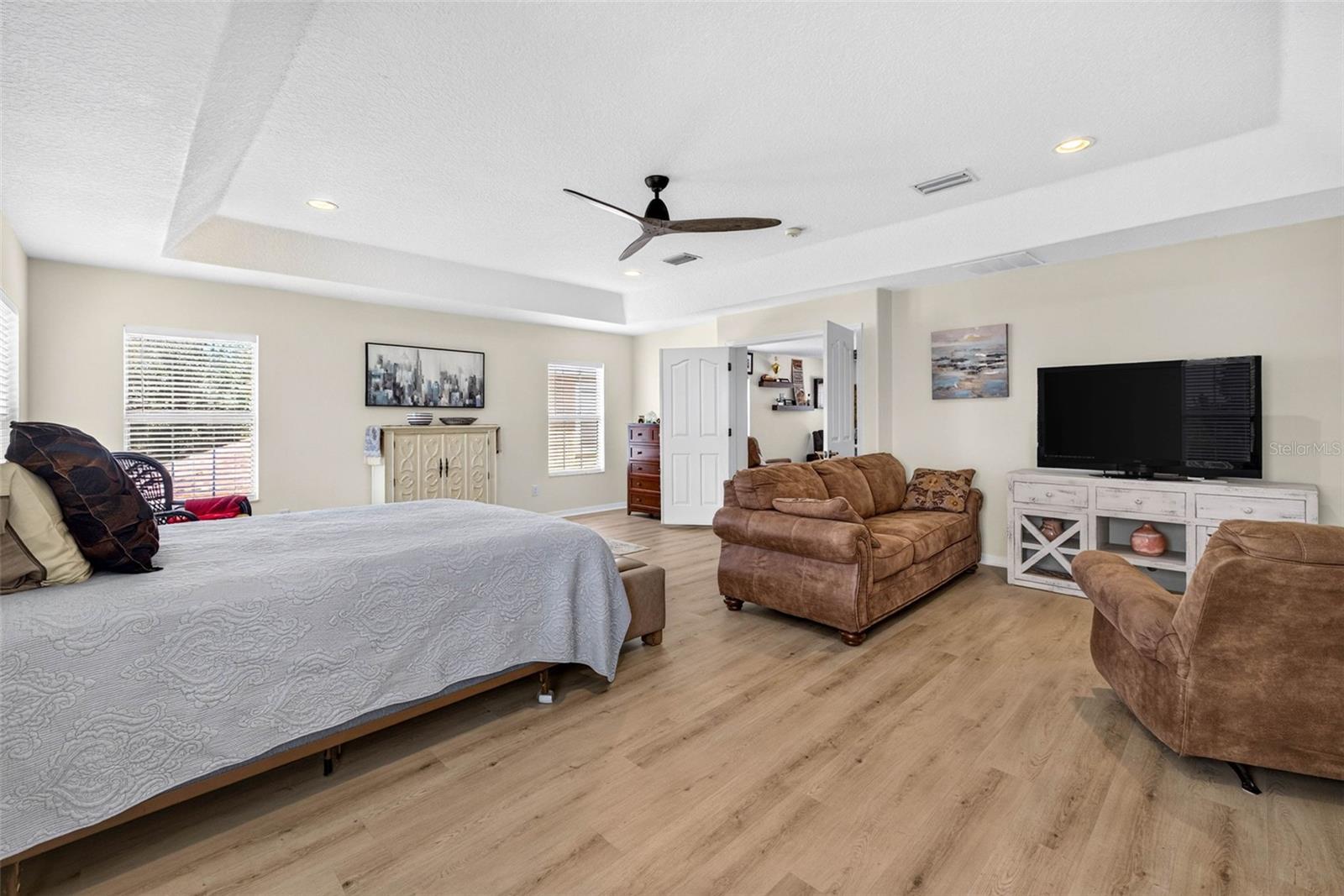 Primary suite has room for an entire living room PLUS bed