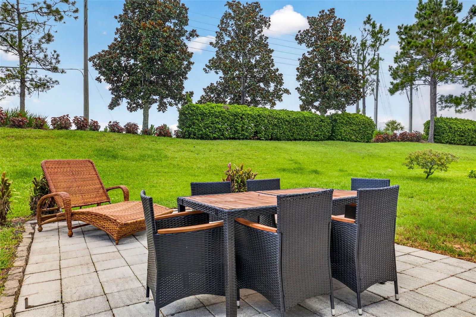 Your outdoor living space has extended patio and great landscaped views