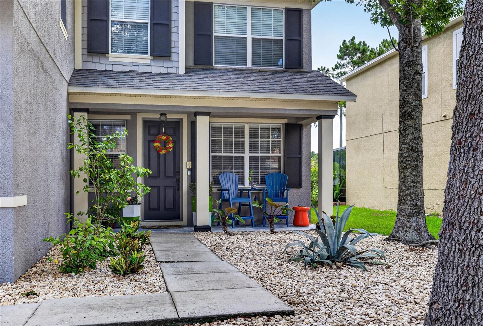 Landscaped front entryway with porch