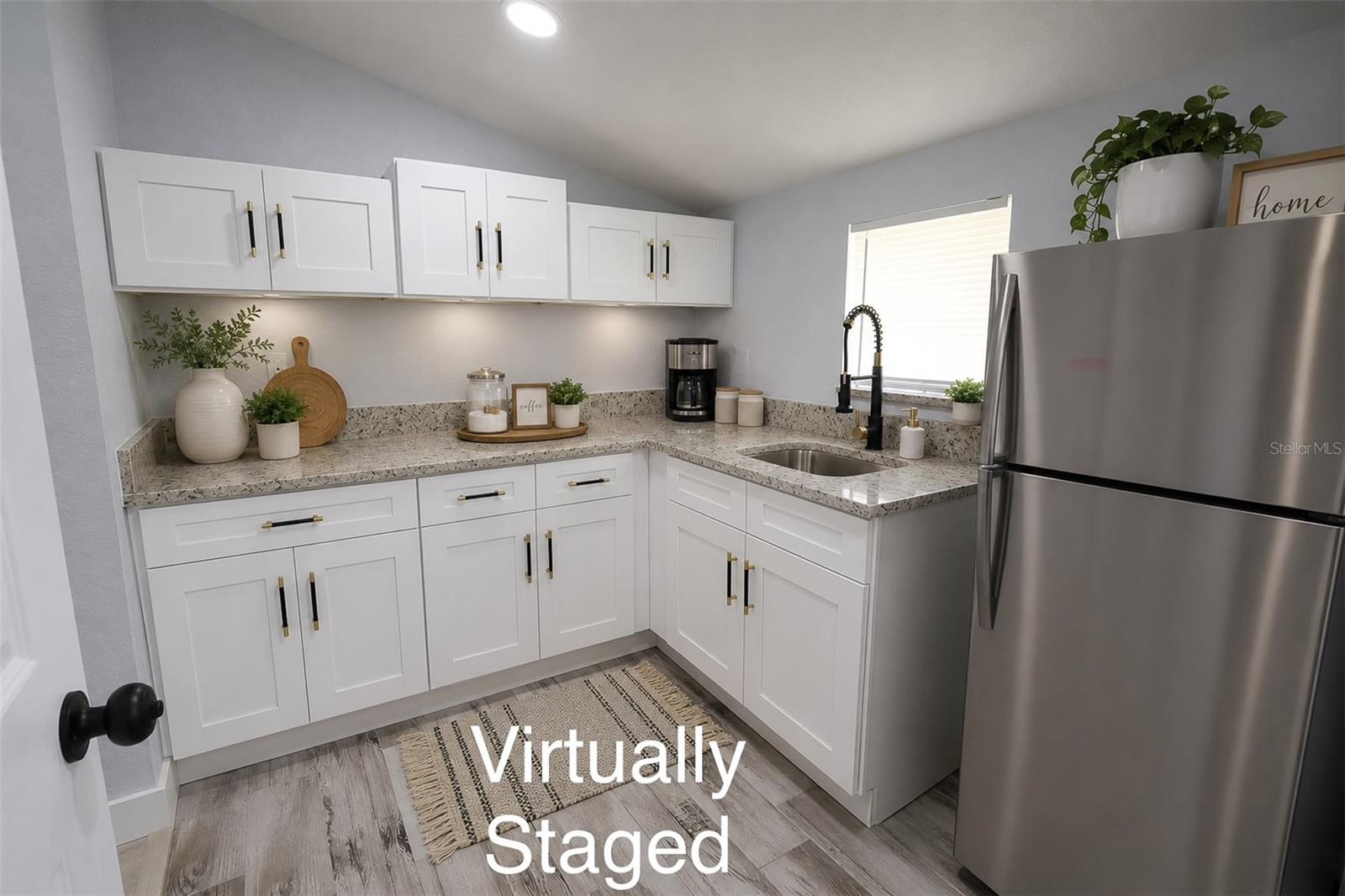 Kitchenette has 2 entry/access doors, one from the master bedroom and the other one leads to the laundry room.