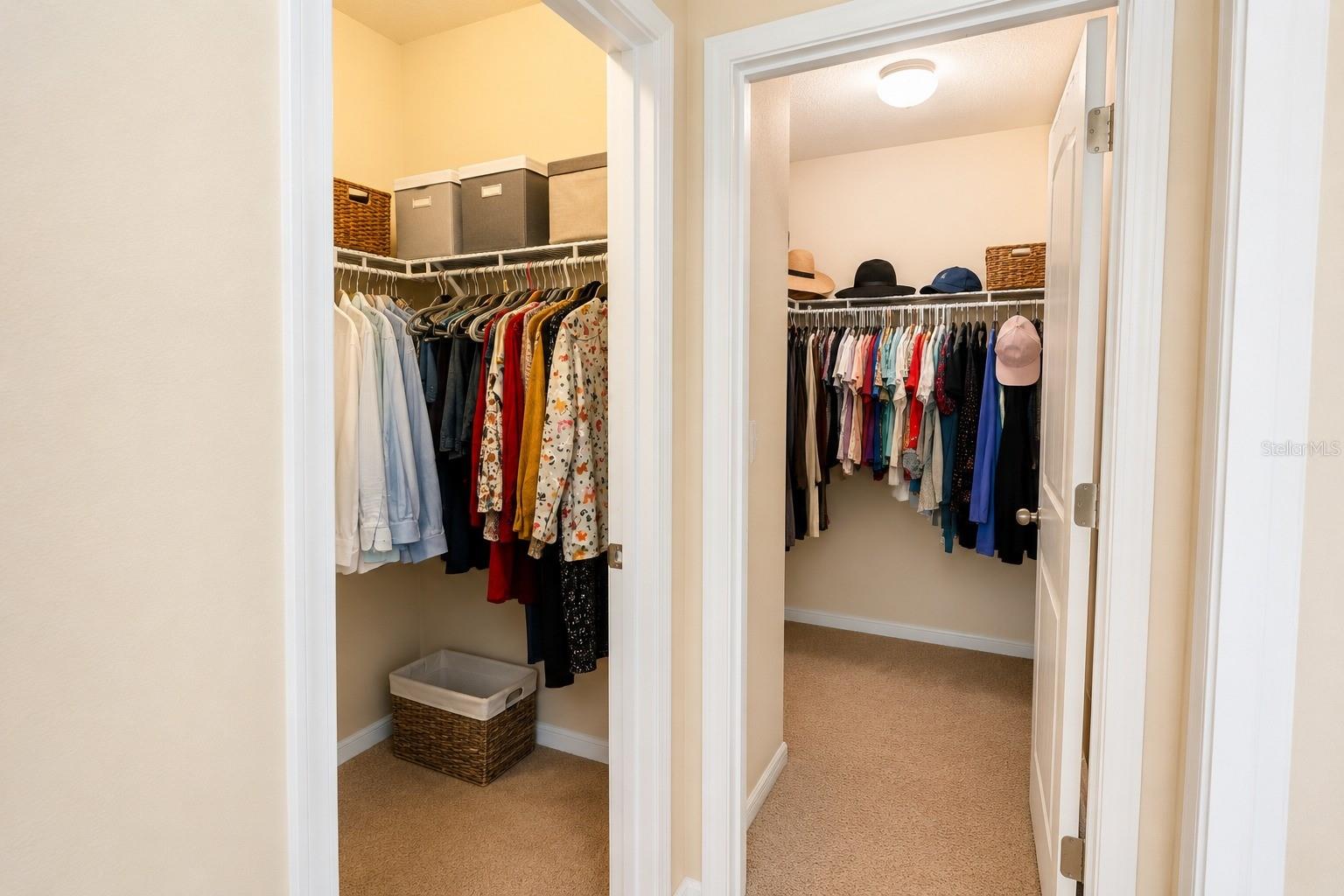 His/Her Walk-in Closets — Image may have been enhanced by AI.
