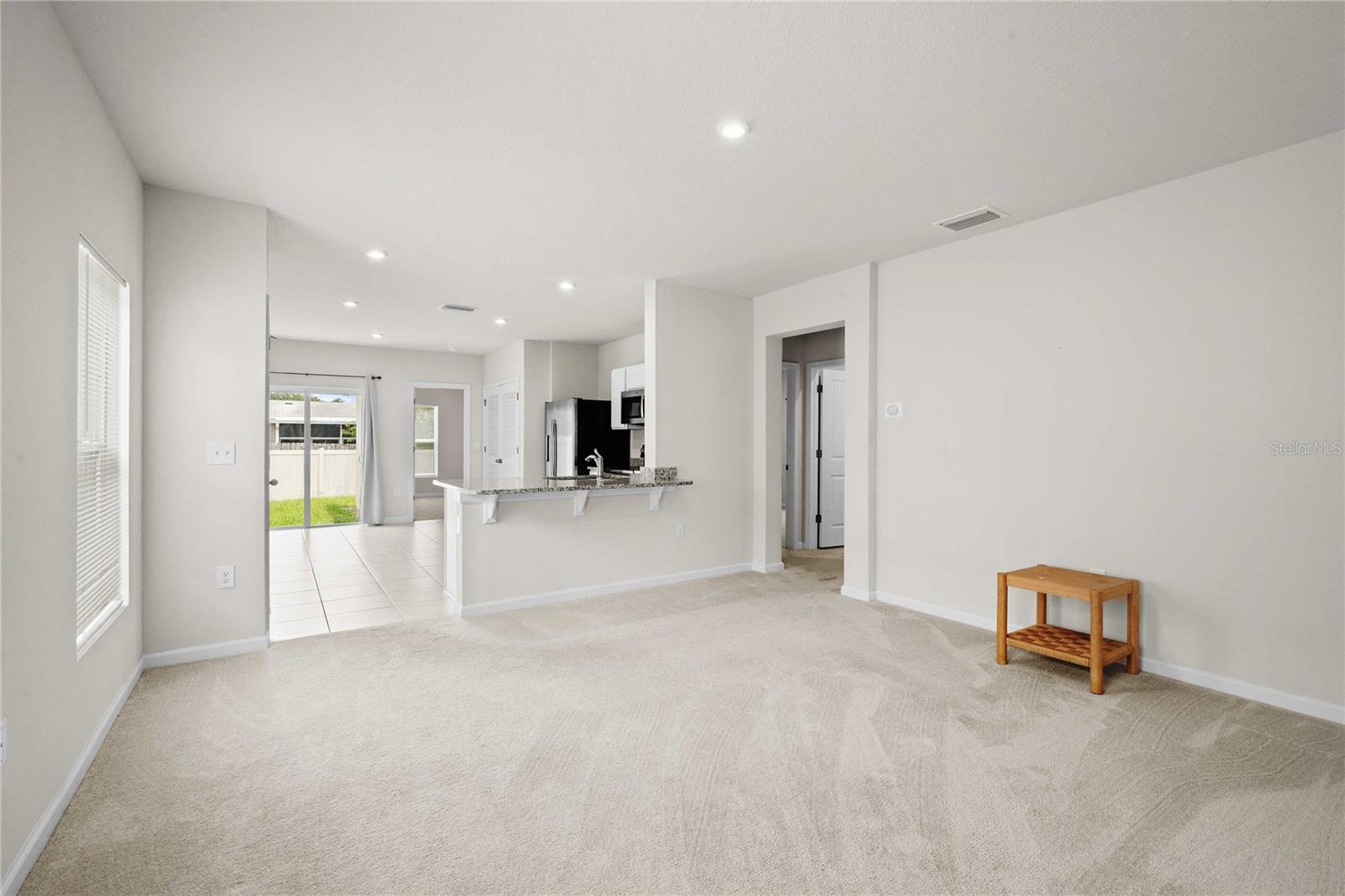 The living room is just off the kitchen