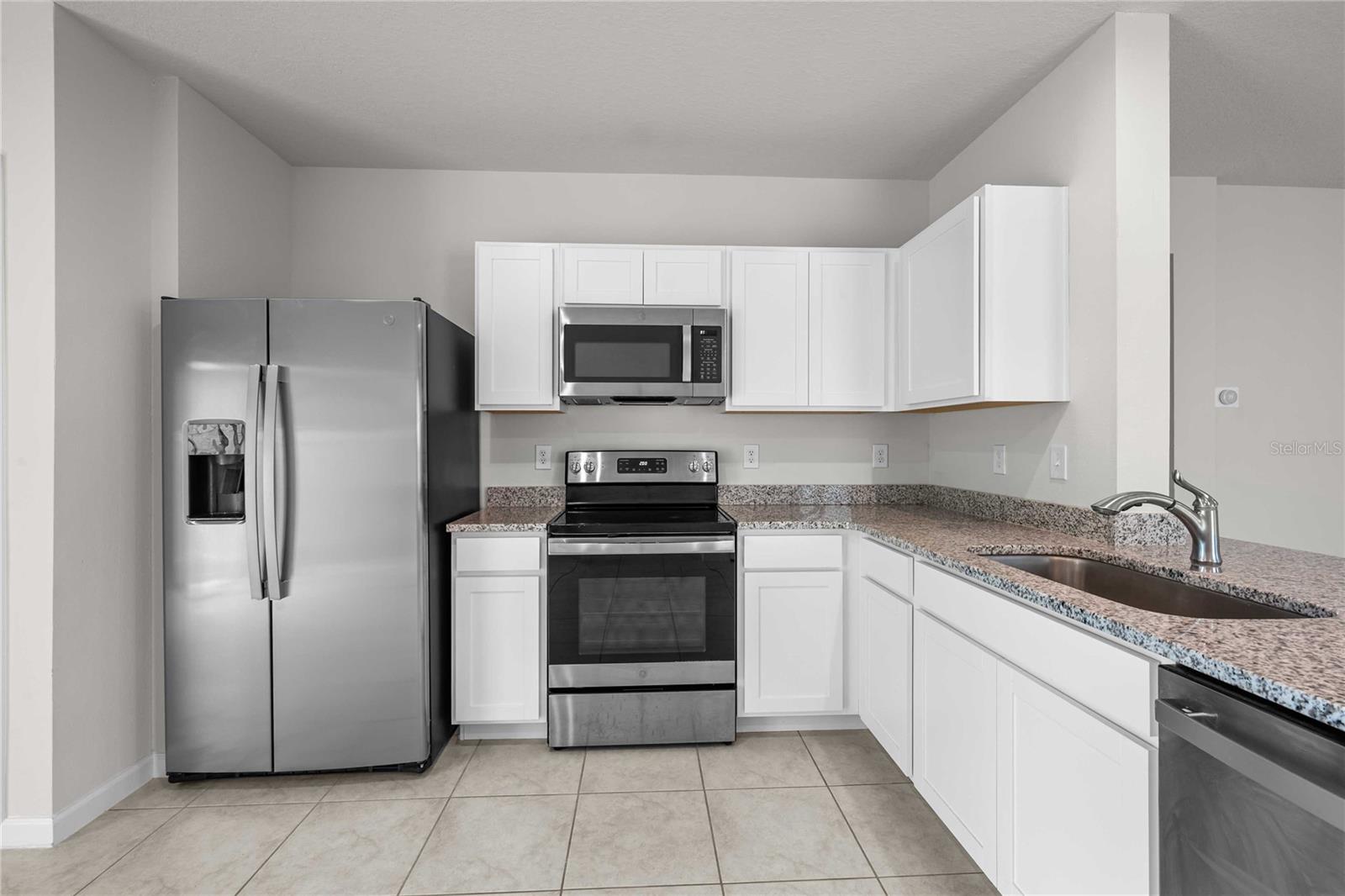 Stylish white mission style cabinets here.