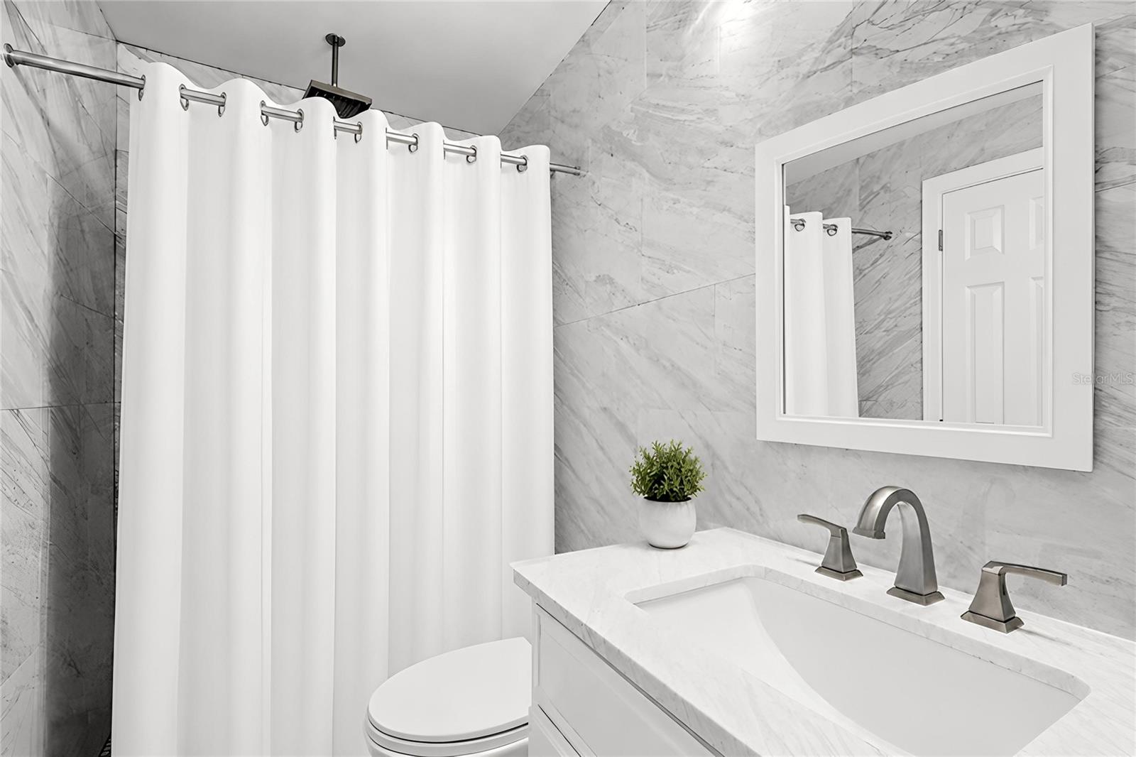 Master Sutie Bathroom.Items virtually removed for photo.