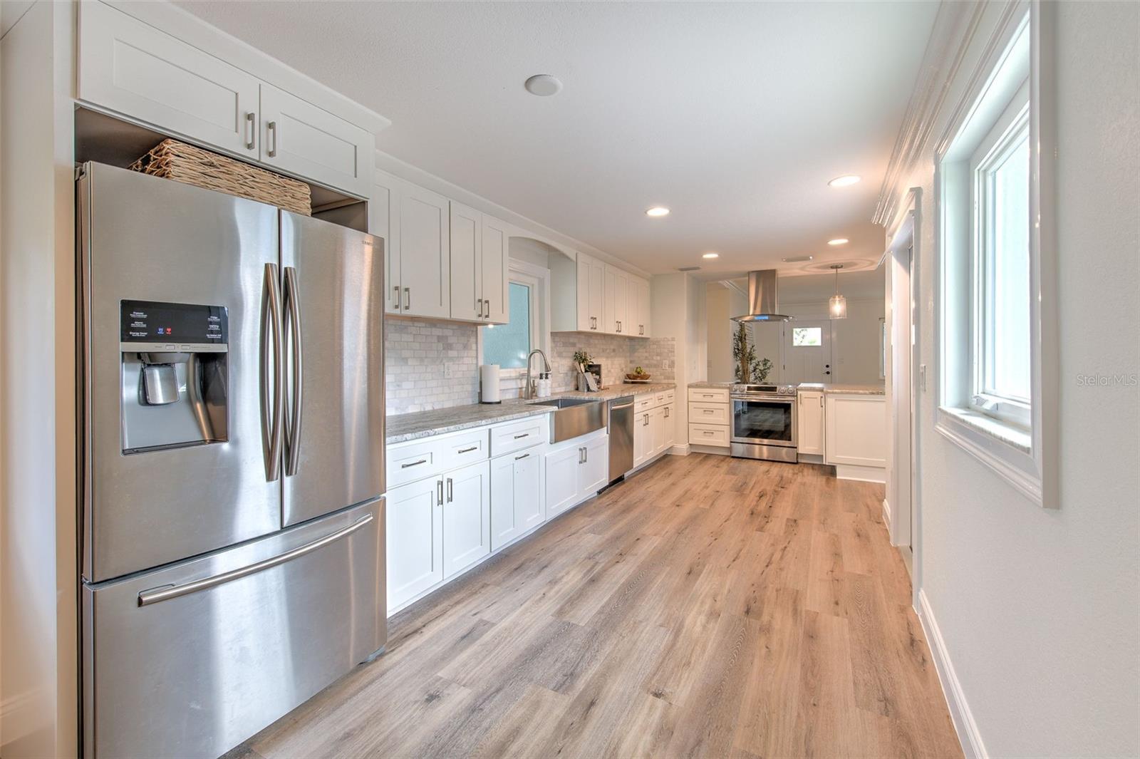 Bright Kitchen with marble backsplash