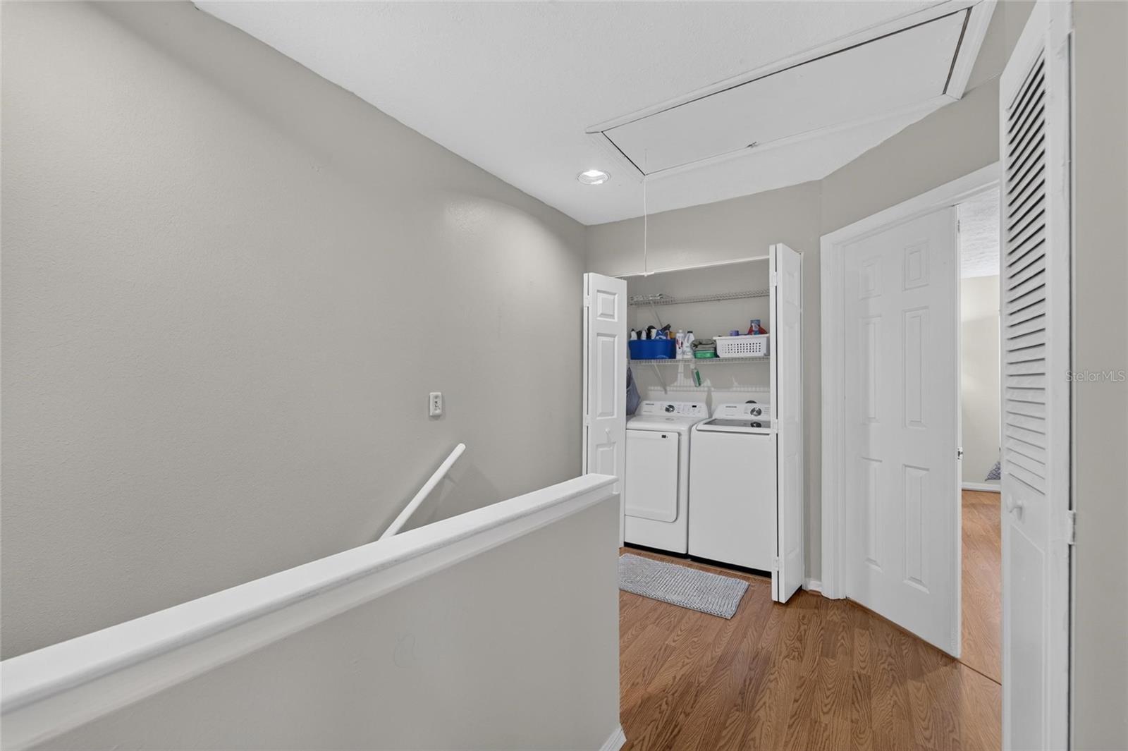 TB8526991 - at top stairs, a laundry closet