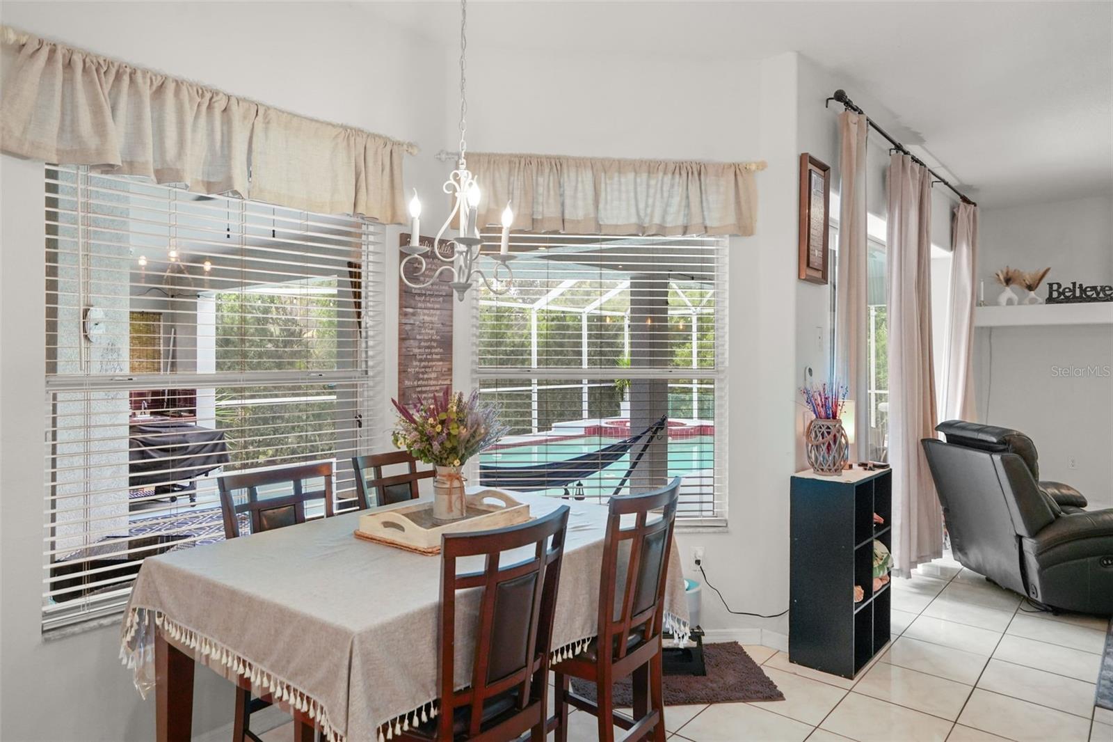 Dining area with sweeping views of the pool!