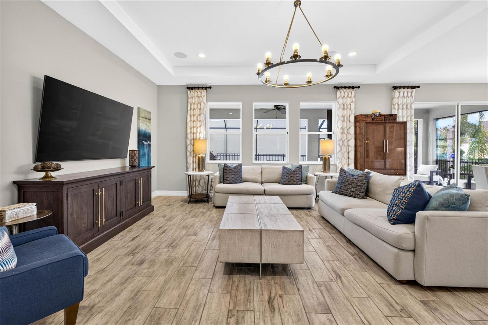 Living room with overhead lighting & stunning daylight.