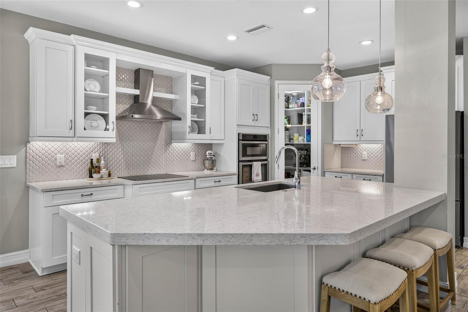 Thick quartz countertops, extended cabinetry, upgraded appliances.