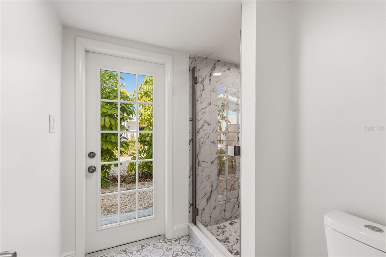 Pool guest can use this side door to access the bathroom