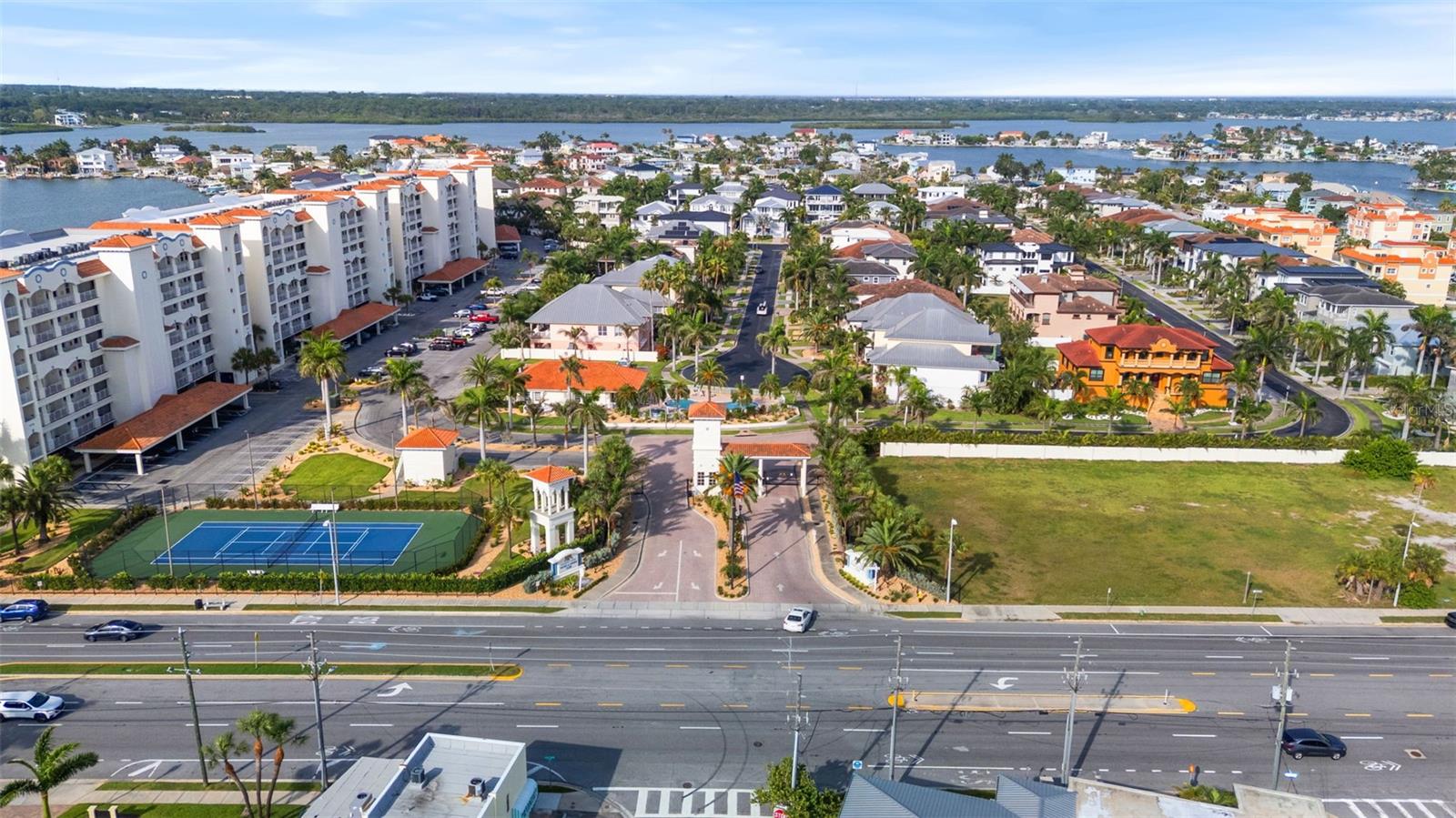 Community over view: from left : •4 condo buildings (waterfront pools , docks , and boardwalks.•tennis courts, parking lot, community clubhouse ( center ) guard gate ( center ) •single family homes to right . All gated and secured . Sitting in Boca CIEGA